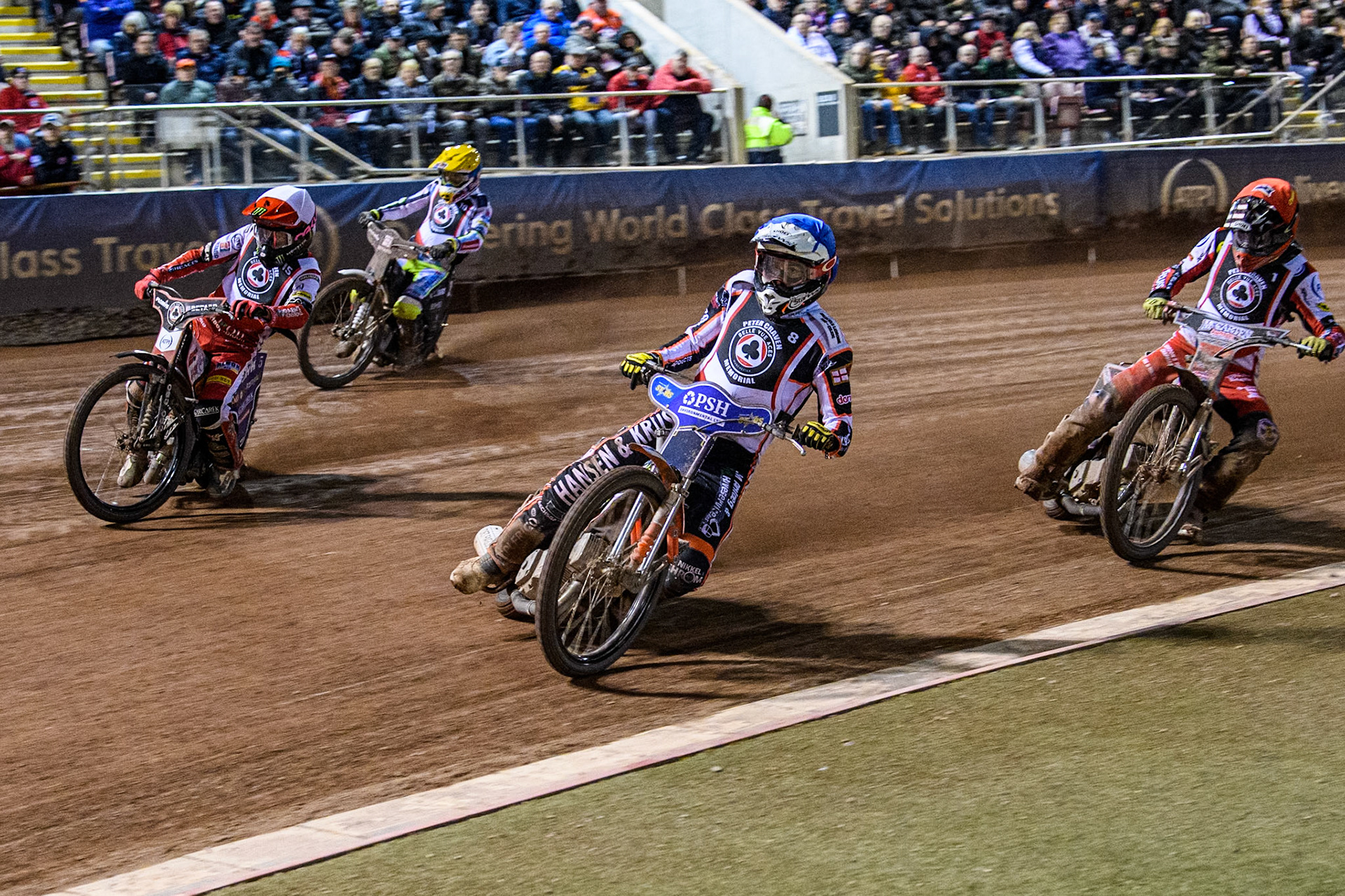 Denmark's Niels-Kristian Iversen (Blue) leads  England's Dan Bewley (White) England's Connor Bailey (Red) and Poland’s Maceij Janowski (Yellow) during the Peter Craven Memorial Trophy meeting at the National Speedway Stadium, Manchester on Monday 18th March 2024. (Photo: Ian Charles | MI News)
