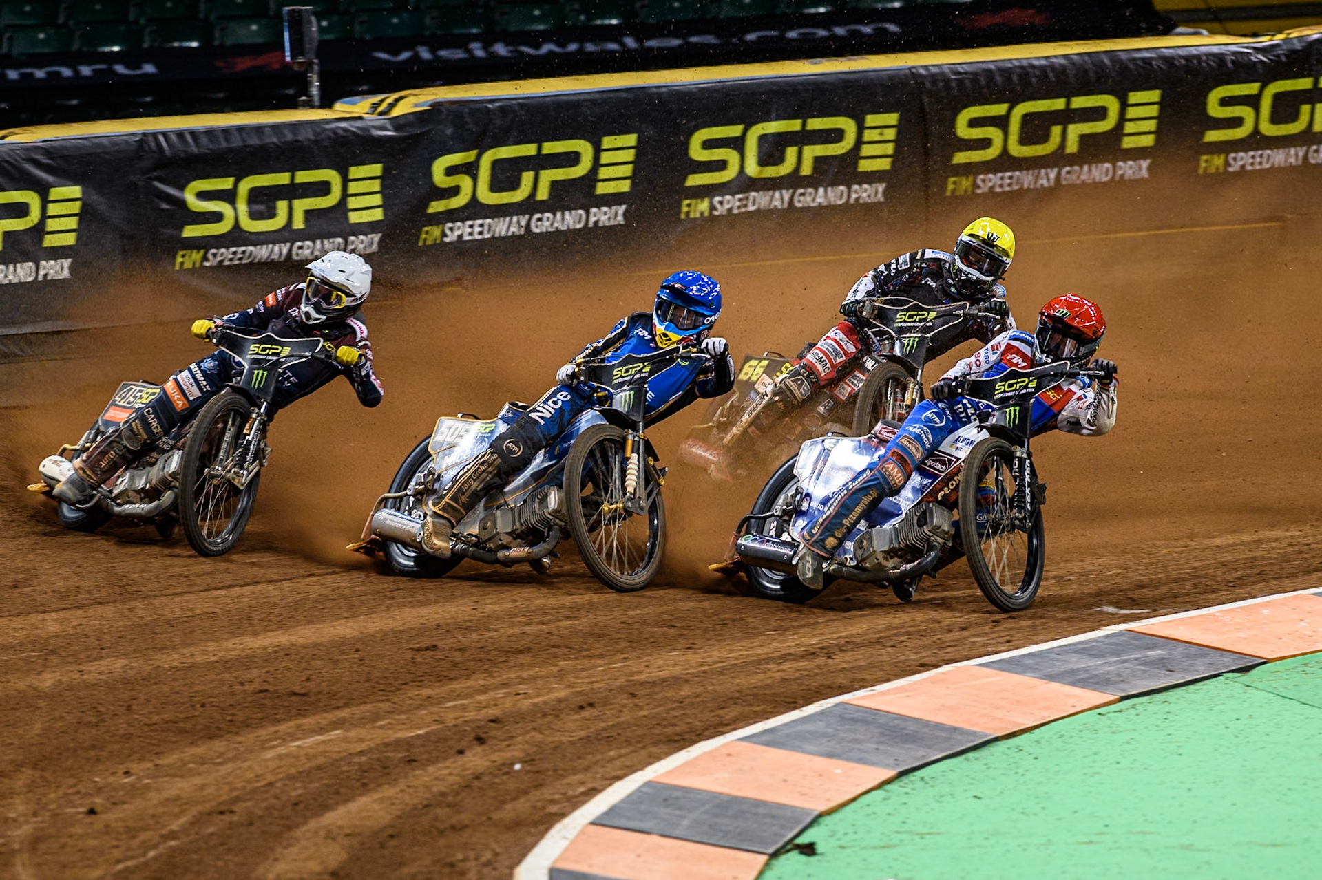 The Grand Final: (L to R) Dominik Kubera (415) of Poland, in White, Robert Lambert (505) of Great Britain in Blue Daniel Bewley (99) of Great Britain in Red with Fredrik Lindgren (66) of Sweden in Yellow behind during the FIM Speedway Grand Prix of Great Britain at The Principality Stadium, Cardiff on Saturday 17th August 2024. (Photo: Ian Charles | MI News)