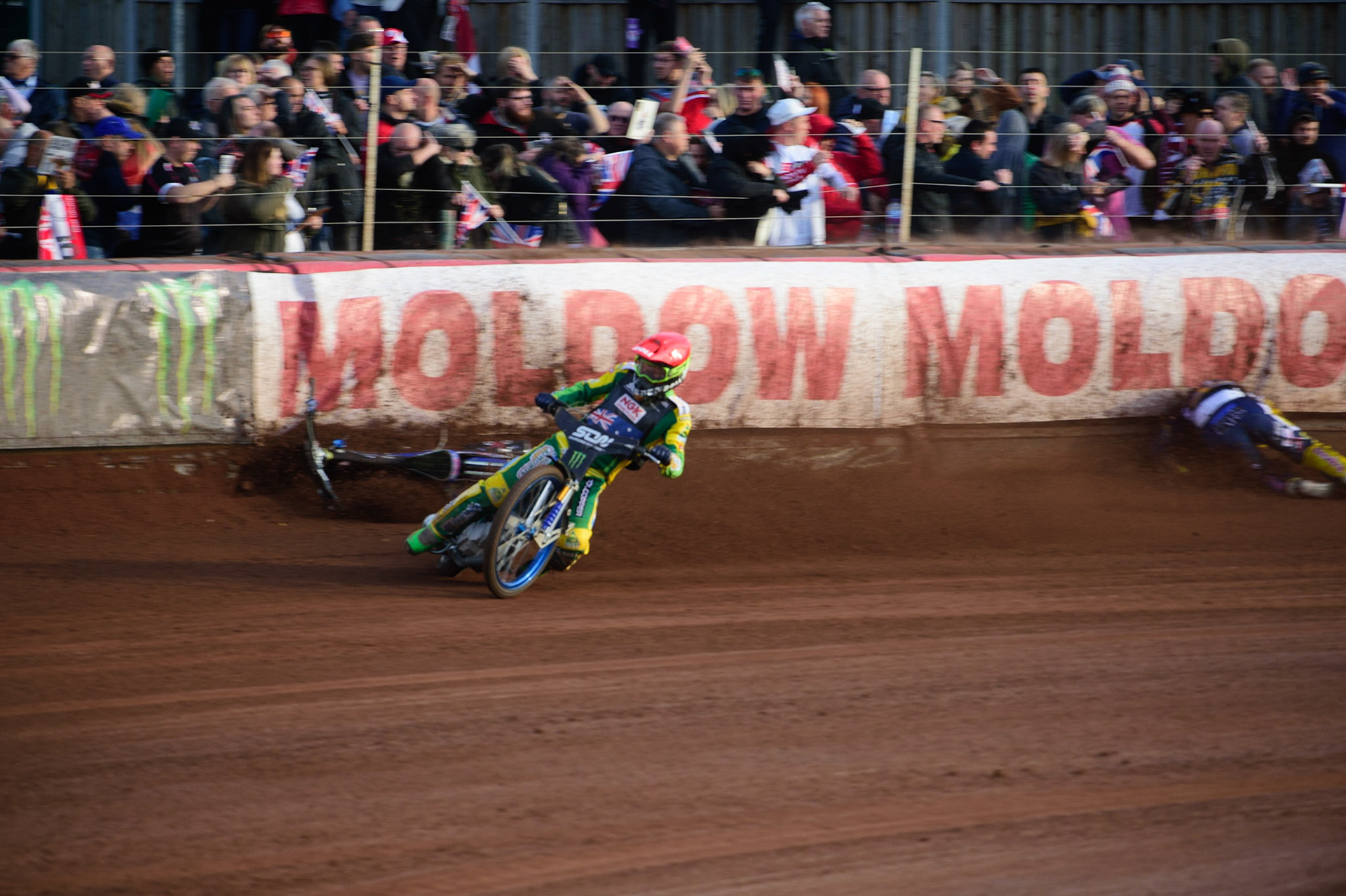 MANCHESTER, UK. OCT 16TH Pontus Aspgren of Sweden (White) slides off as Jacob Thorsell of Sweden hits the airfence during the Monster Energy FIM Speedway of Nations at the National Speedway Stadium, Manchester on Saturday  16th October 2021. (Credit: Ian Charles | MI News)