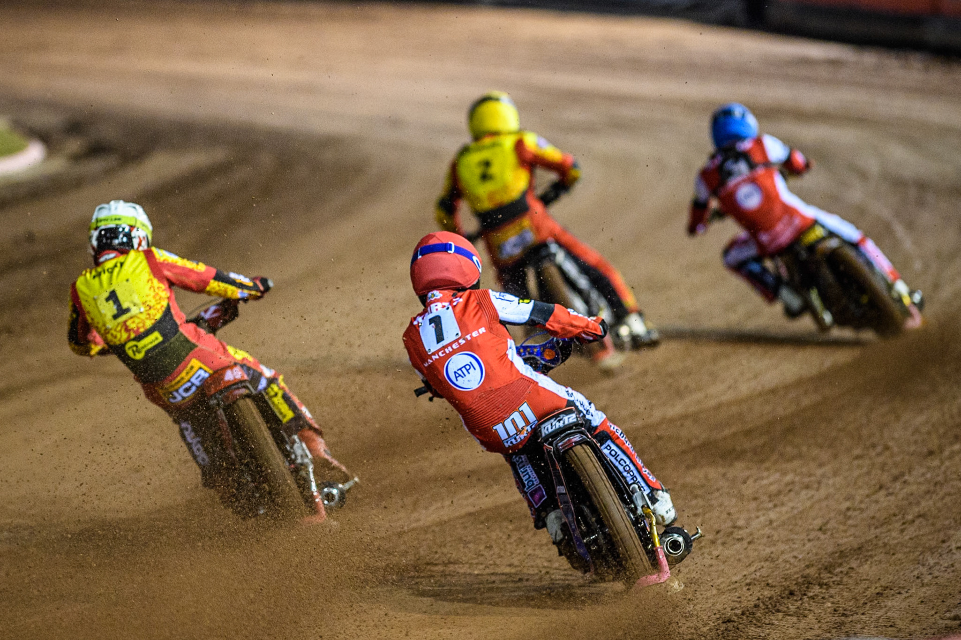Belle Vue Aces' Brady Kurtz  in Red chases Leicester Lions' Max Fricke in White, Belle Vue Aces' Norick Blodorn  in Blue and Leicester Lions' Richard Lawson  in Yellow during the Rowe Motor Oil Premiership Grand Final 1st Leg between Belle Vue Aces and Leicester Lions at the National Speedway Stadium, Manchester on Monday 23rd September 2024. (Photo: Ian Charles | MI News)