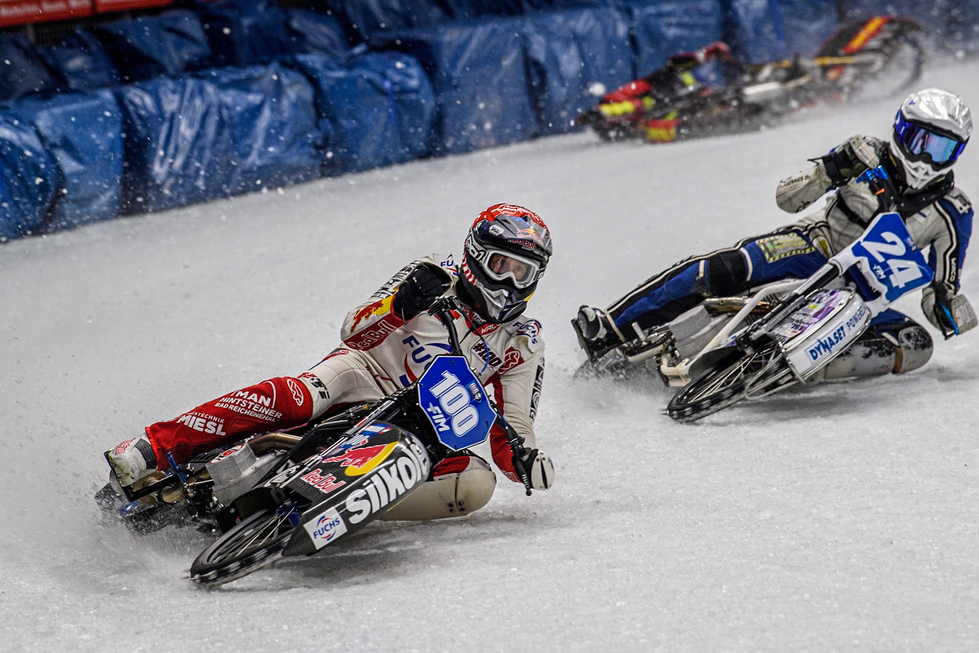 Austria's Franz Zorn (100) (Red) leads  Finland's Max Koivula (24)  as Netherlands' Jasper Iwema (800) falls behind them during the FIM Ice Speedway Gladiators World Championship Final 1 at the Max-Aicher-Arena, Inzell on Saturday 23 March 2024. (Photo: Ian Charles | MI News)