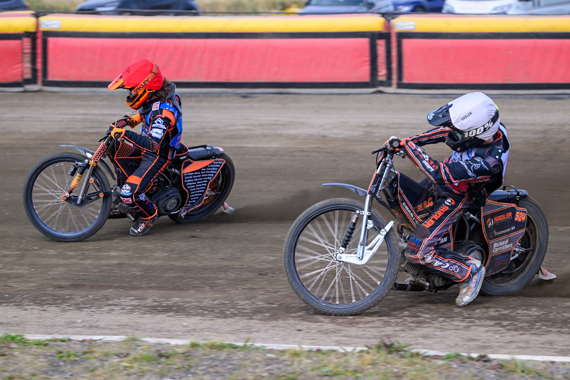 Jack Smith of Buxton Bulls in Red leading Harry Sadler of Middlesborough Tigers in White during the WSRA National Development League match  between Buxton Bulls and Middlesborough Tigers at Hi-Edge Speedway, Buxton on Sunday 16th August 2026. (Photo: Ian Charles | MI News)