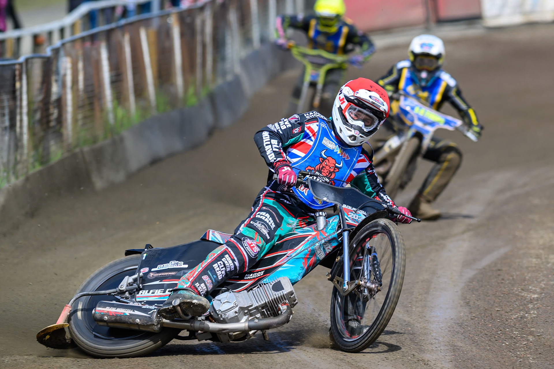 Alfie Bowtell of Buxton Bulls in Red leading Dayle Wood of Edinburgh Monarchs Academy in White and Ben Whalley of Edinburgh Monarchs Academy in Yellow during the WSRA National Development League match between Buxton Bulls and Edinburgh Monarchs Academy at Hi-Edge Speedway, Buxton on Sunday 14th June 2026. (Photo: Ian Charles | MI News)