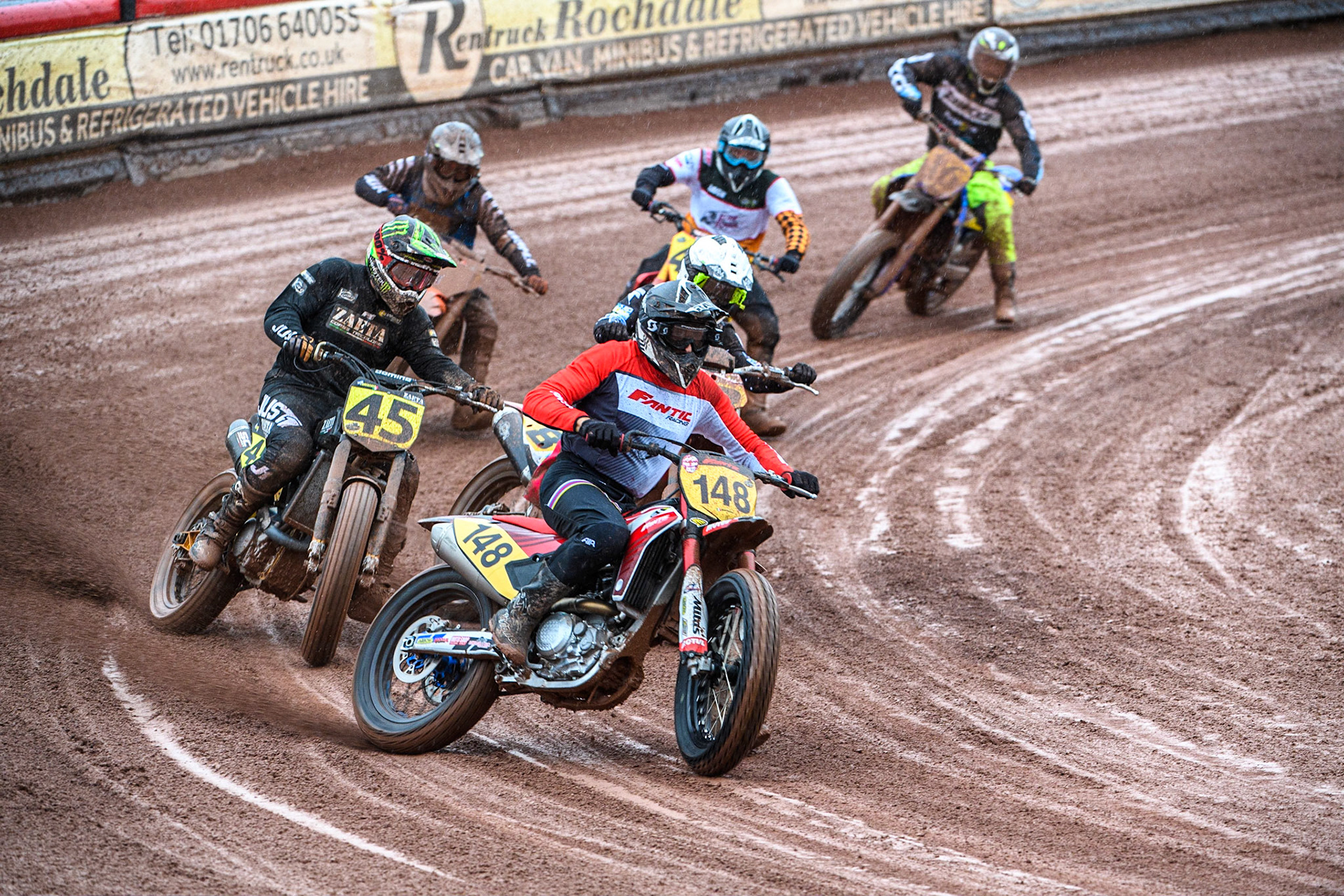 Vittorio Emanuele Marzotto (148) from Italy leads Matias Lorenzato (45) from Argentina and the rest of the pack during the FIM World Flat Track Championship Round 1 at the National Speedway Stadium, Manchester on Saturday 5th August 2023. (Photo: Ian Charles | MI News)