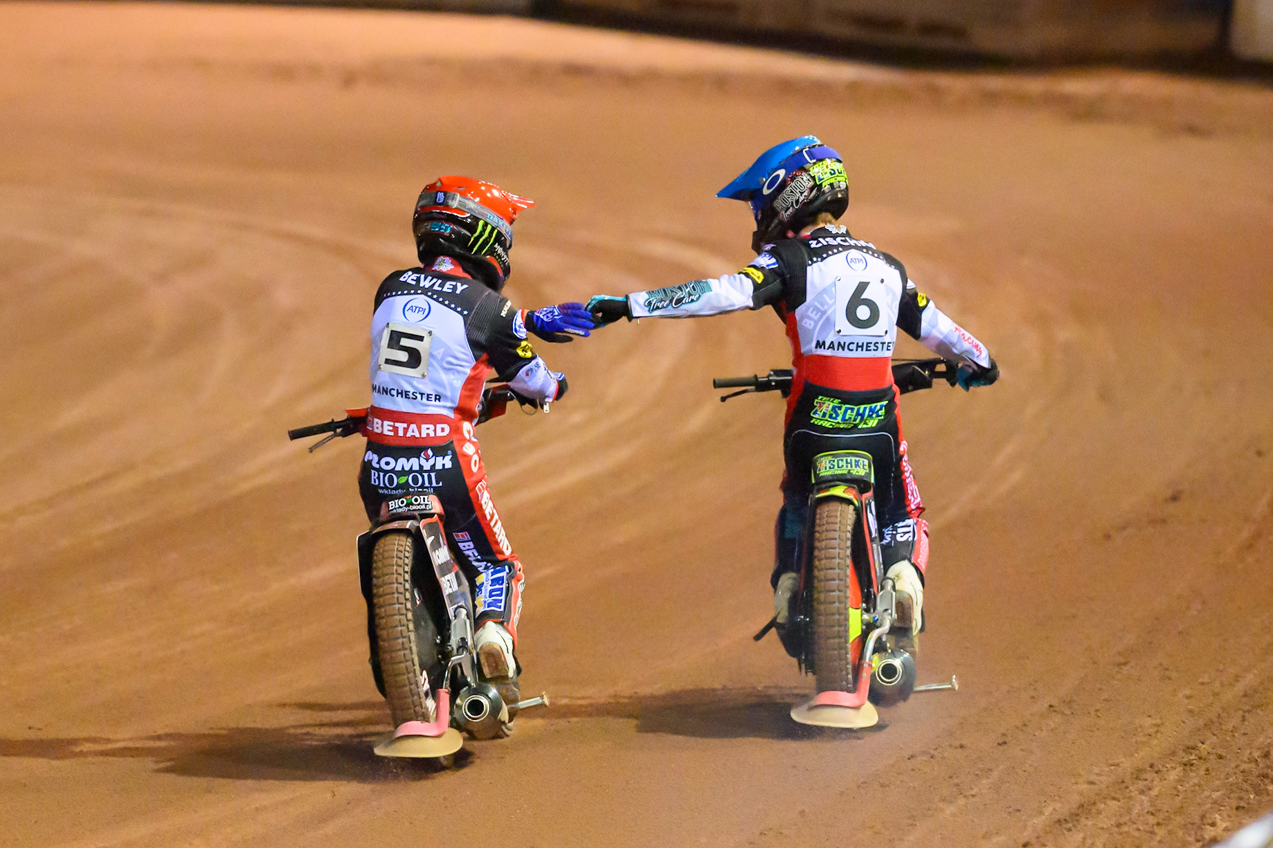 Dan Bewley of Belle Vue Aces   in Red congratulates Tate Zischke of Belle Vue Aces  in Blue on his win during the Knockout Cup, Northern Section match between Belle Vue Aces and Sheffield Tigers at the National Speedway Stadium, Manchester on Monday 30th March 2026. (Photo: Ian Charles | MI News)