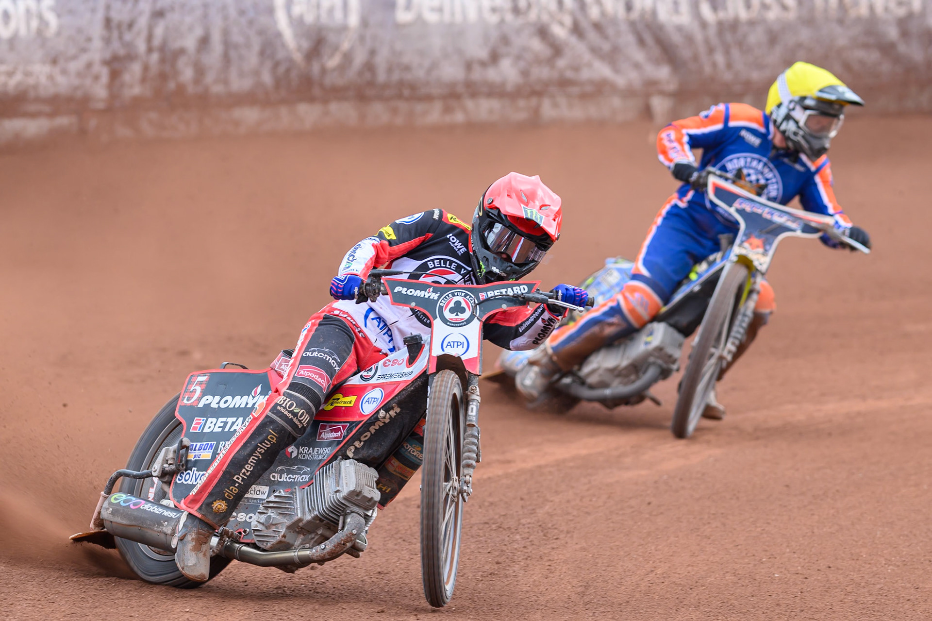 Dan Bewley of Belle Vue Aces in Red leading Troy Batchelor of Northampton Foxes in Yellow during the Rowe Motor Oil Premiership match between Belle Vue Aces and Northampton Foxes at the National Speedway Stadium, Manchester on Monday 4th May 2026. (Photo: Ian Charles | MI News)