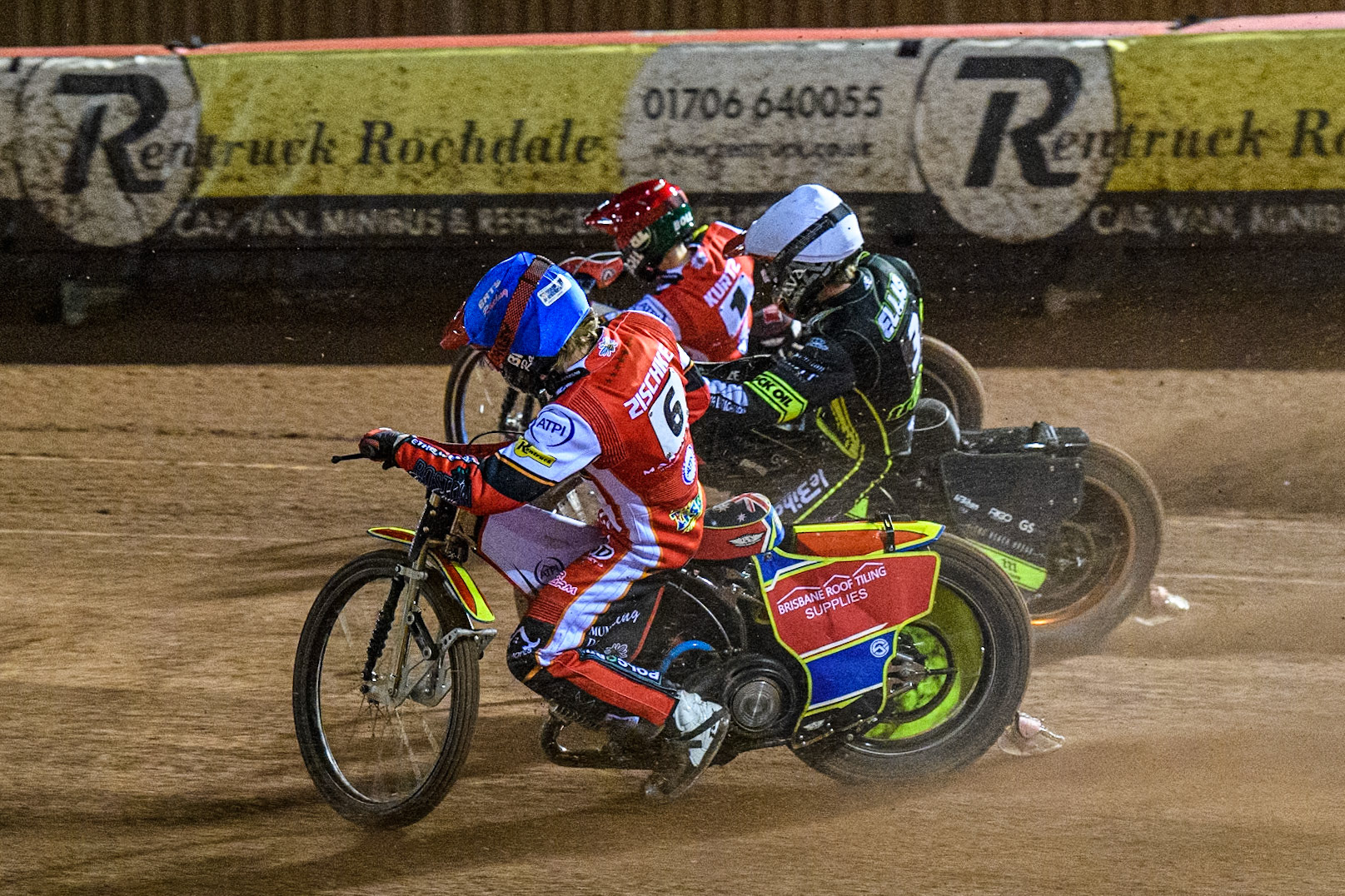 Tate Zischke of Belle Vue Aces  in Blue rides inside Adam Ellis of Ipswich Witches in White and Brady Kurtz of Belle Vue Aces in Red during the Premiership Cup Quarter Final 1st Leg match between Belle Vue Aces and Ipswich Witches at the National Speedway Stadium, Manchester on Monday 24th March 2025. (Photo: Ian Charles | MI News)