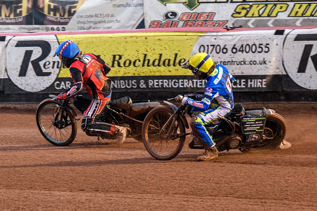 Oxford Chargers' Senna Summers  in Yellow chases Belle Vue Colts' Harry McGurk  in Blue during the WSRA National Development League match between Belle Vue Colts and Oxford Chargers at the National Speedway Stadium, Manchester on Friday 2nd August 2024. (Photo: Ian Charles | MI News)