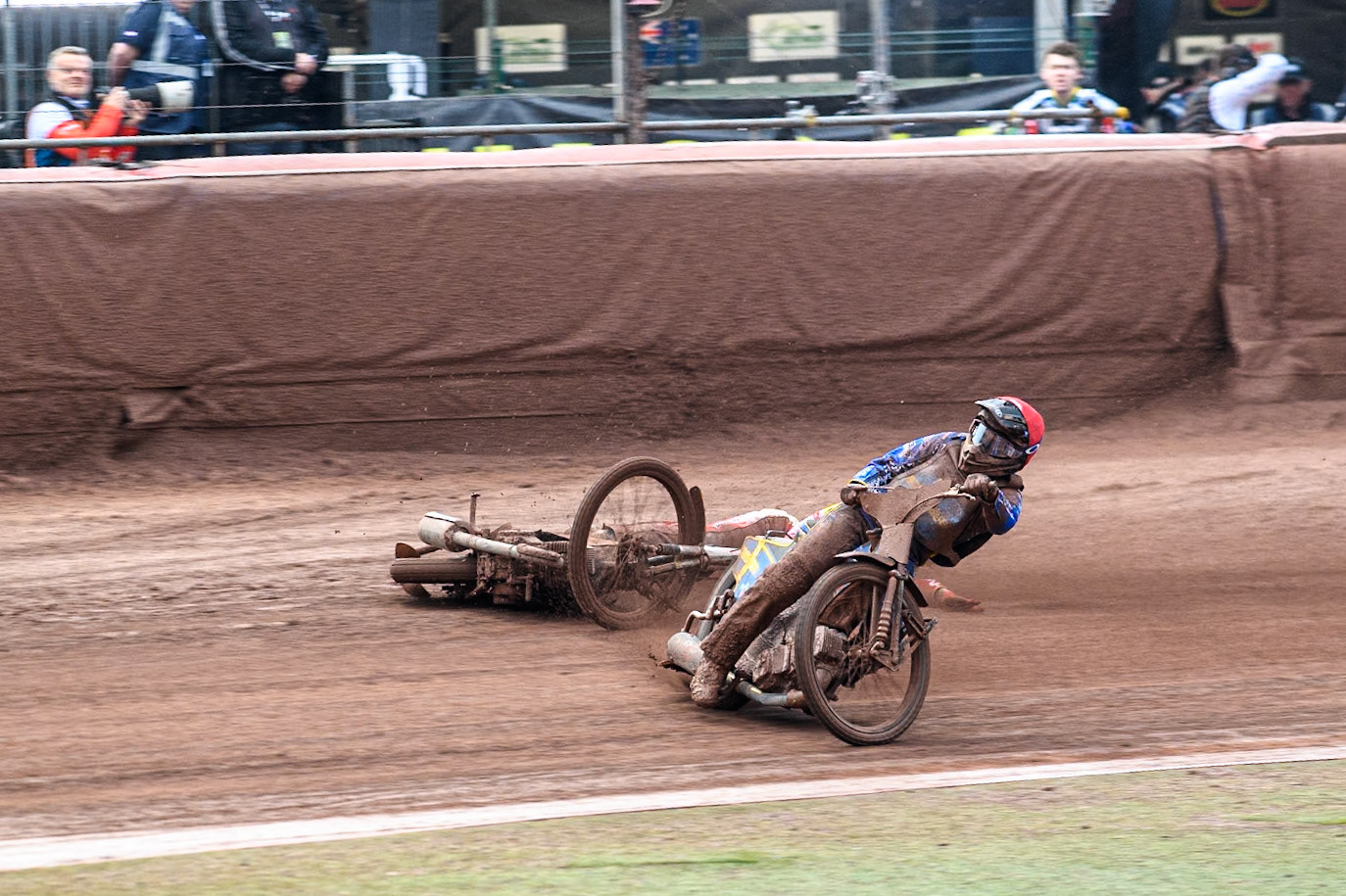Bartosz Banbor of Poland falls behind Philip Hellström-Bängs of Sweden in Red during the Monster Energy FIM Speedway of Nations 2 (Under 21) Final at the National Speedway Stadium, Manchester on Friday 12th July 2024. (Photo: Ian Charles | MI News)