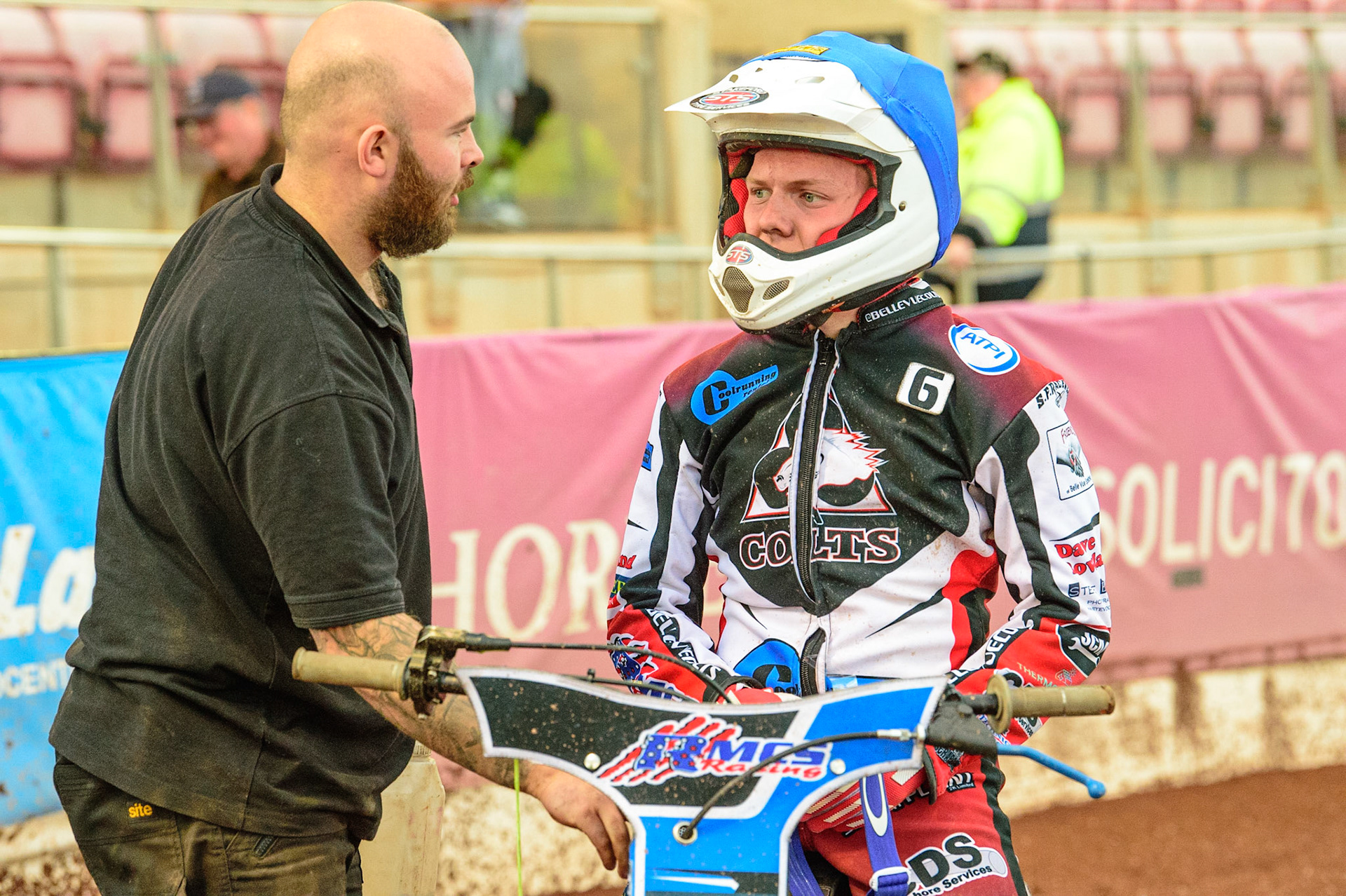Archie Freeman  (right) chats with his mechanic during the National Development League match between Belle Vue Colts and Mildenhall Fens Tigers at the National Speedway Stadium, Manchester on Friday 15th July 2022. (Credit: Ian Charles | MI News)