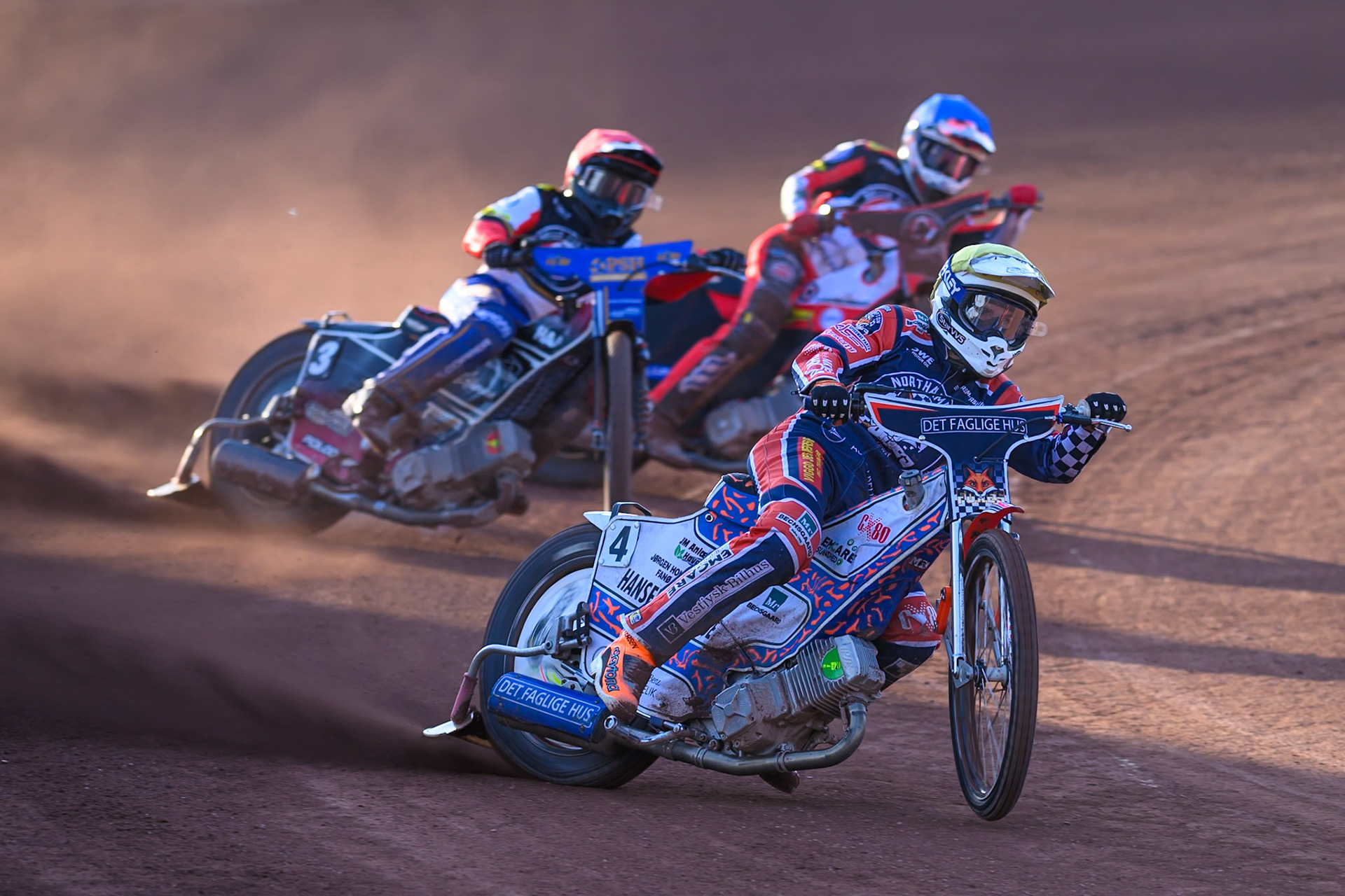 Niels-Kristian Iversen of Northampton Foxes in Yellow leading Ben Cook, Guest Rider for Belle Vue Aces in Red and Zach Cook of Belle Vue Aces  in Blue  during the Rowe Motor Oil Premiership match between Belle Vue Aces and Northampton Foxes at the National Speedway Stadium, Manchester on Monday 13th July 2026. (Photo: Ian Charles | MI News)