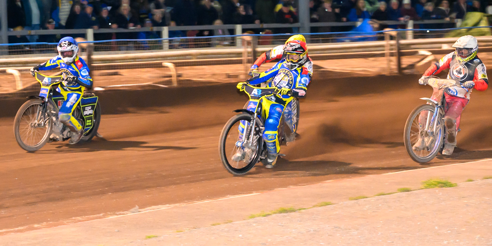 Josh Pickering of Sheffield Tigers  in Red and Jye Etheridge of Sheffield Tigers  in Blue leading Chris Harris Guest Rider for Belle Vue Aces in White and Kye Thomson, Guest Rider for Belle Vue Aces in Yellow during the Knockout Cup Northern Section match between Sheffield Tigers and Belle Vue Aces at Owlerton Stadium, Sheffield on Thursday 2nd April 2026. (Photo: Ian Charles | MI News)