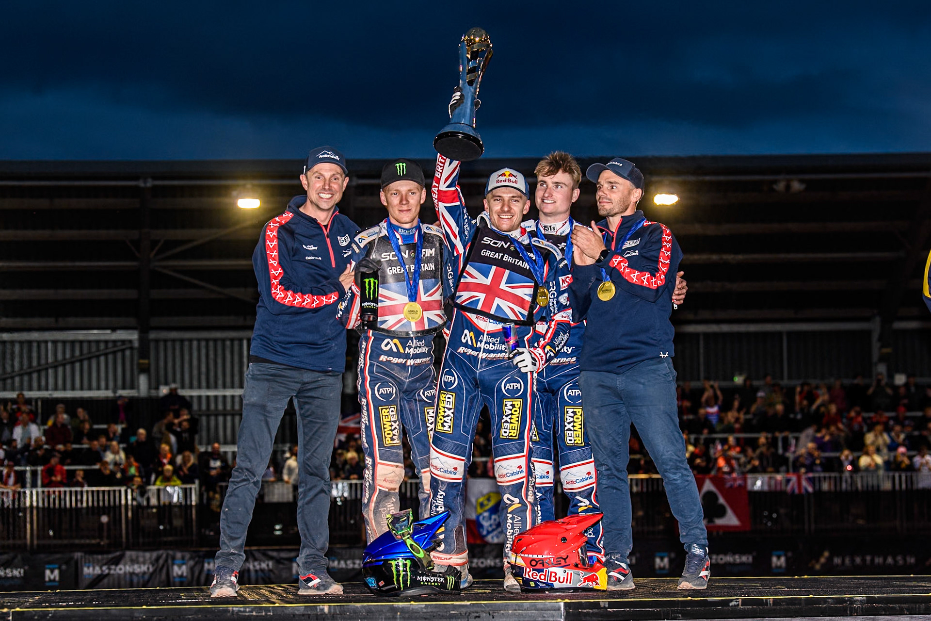 GREAT BRITAIN World Champions: (L to R) British Joint Team manager, Simon Stead, Dan Bewley, Robert Lambert, Tom Brennan, British Joint Team manager, Oliver Allen celebrate winning the trophy during the Monster Energy FIM Speedway of Nation Final at the National Speedway Stadium, Manchester on Saturday 13th July 2024. (Photo: Ian Charles | MI News)