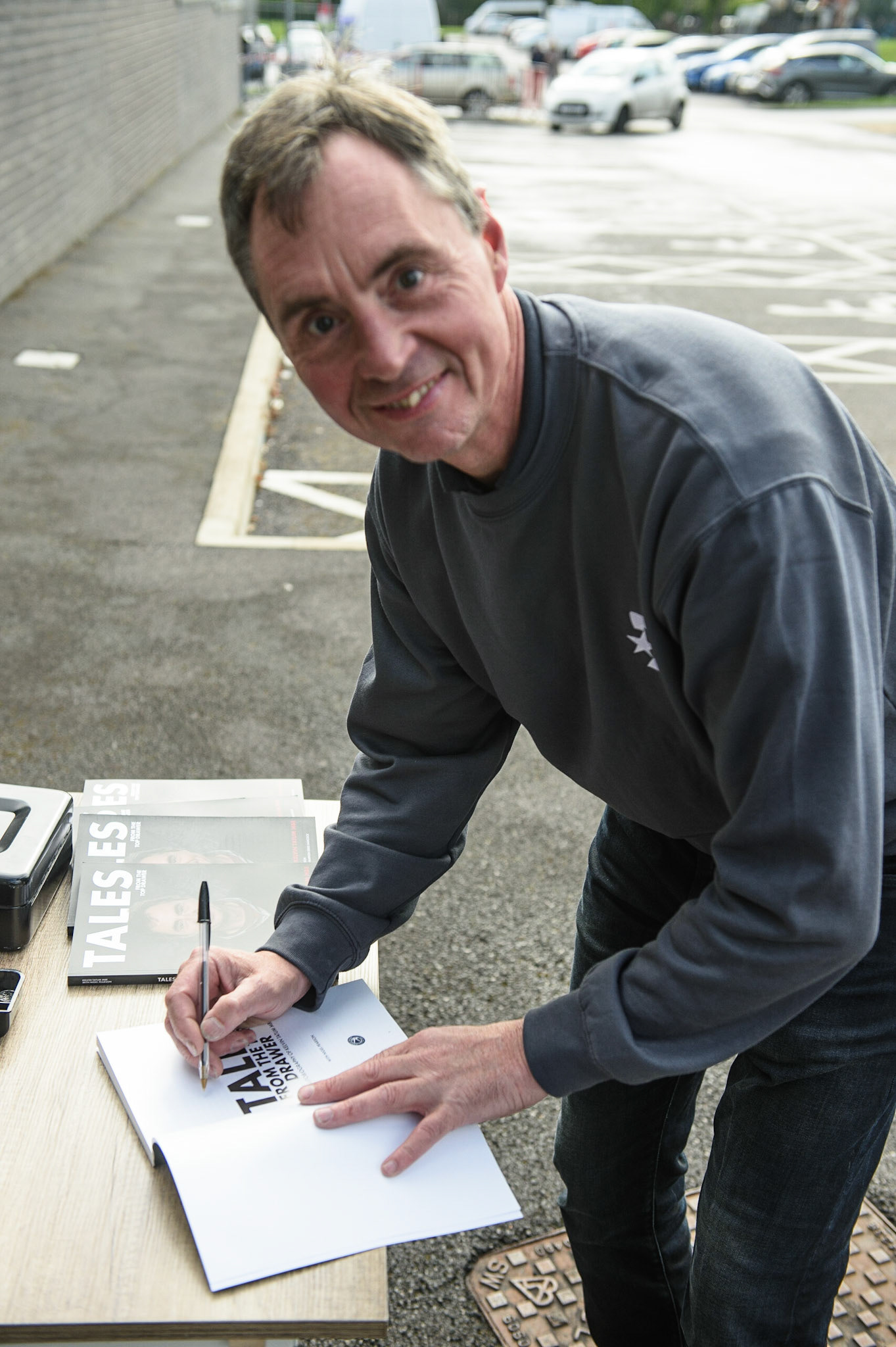 MANCHESTER, UK. AUGUST 16TH   Former rider and Eurosport commentator Kelvin Tatum, at the signing session for his Autobiography outside the NSS during the Sports Insure British Speedway Finals at the National Speedway Stadium, Manchester on Monday 16th August 2021. (Credit: Ian Charles | MI News)