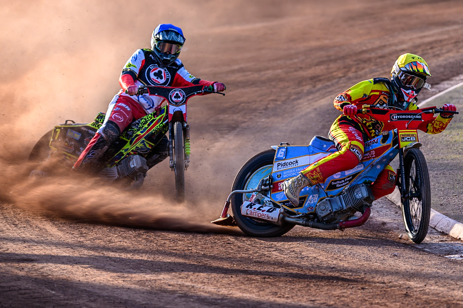 Leicester Lions' Drew Kemp  in Yellow leading Belle Vue Aces' Will Cairns in Blue during the Rowe Motor Oil Premiership match between Belle Vue Aces and Leicester Lions at the National Speedway Stadium, Manchester on Monday 14th July 2025. (Photo: Ian Charles | MI News)