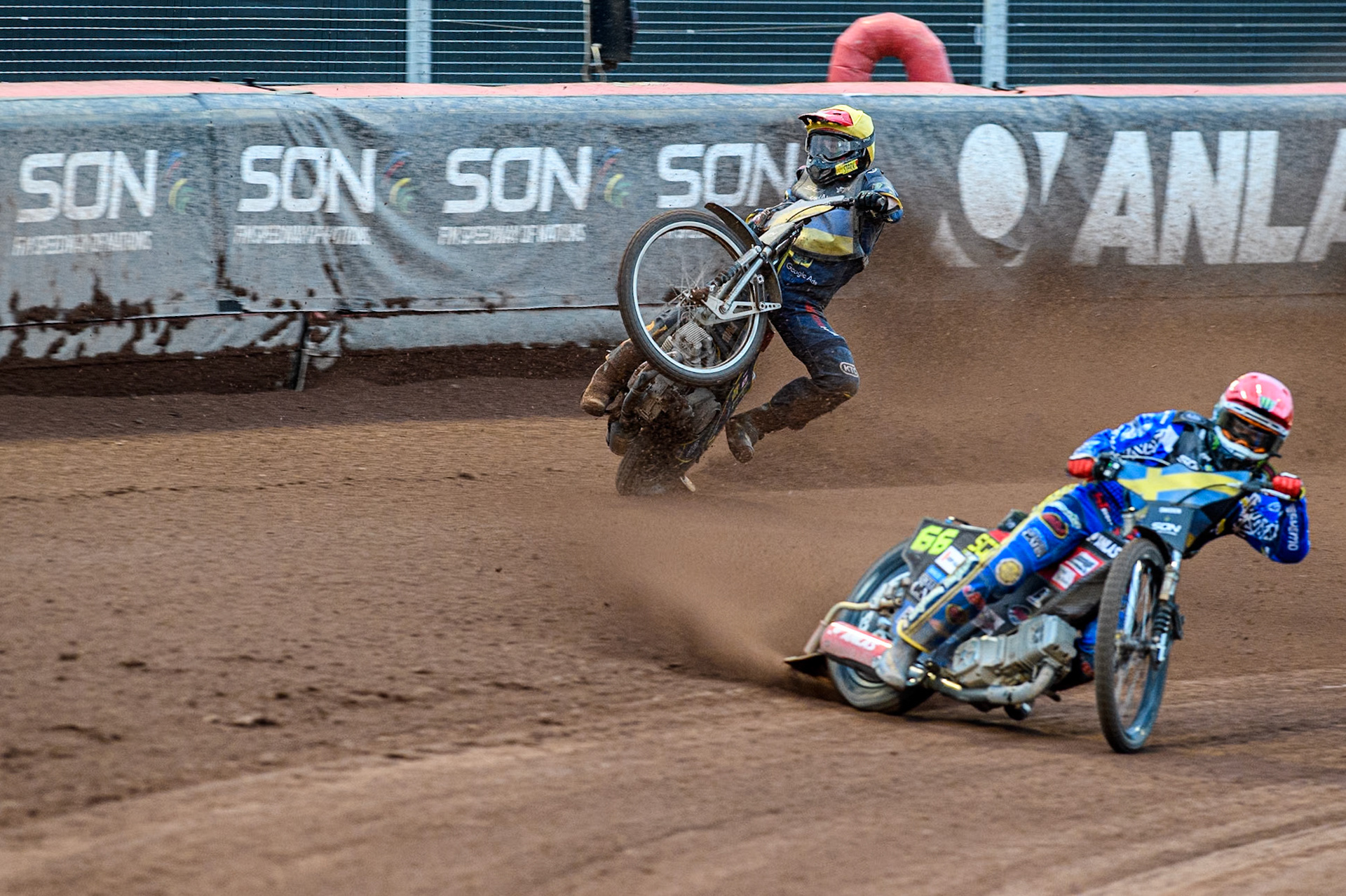 Marko Levishyn of Ukraine in Yellow crashes out of his final heat during the Monster Energy FIM Speedway of Nations Semi-Final 1 at the National Speedway Stadium, Manchester on Tuesday 9th July 2024. (Photo: Ian Charles | MI News)