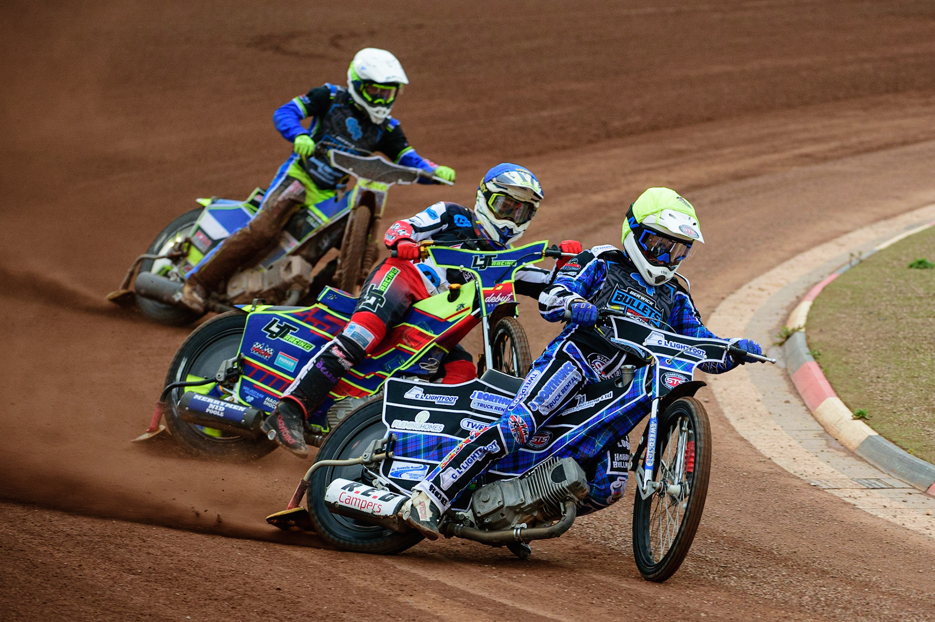 MANCHESTER, UK. JUN 24TH  Greg Blair  (Yellow) leads Nathan Ablitt  (Blue) and Ben Rathbone  (White) during the National Development League match between Belle Vue Colts and Berwick Bullets at the National Speedway Stadium, Manchester on Friday 24th June 2022. (Credit: Ian Charles | MI News)