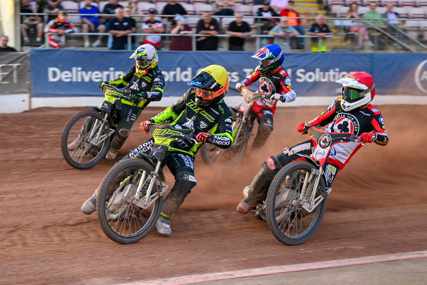 Jason Edwards of Ipswich Witches in Yellow leading Richard Lawson of Ipswich Witches in White Peter Kildemand of Belle Vue Aces in Red and William Cairns of Belle Vue Aces in Blue during the Rowe Motor Oil Premiership match between Belle Vue Aces and Ipswich Witches at the National Speedway Stadium, Manchester on Saturday 20th June 2026. (Photo: Ian Charles | MI News)