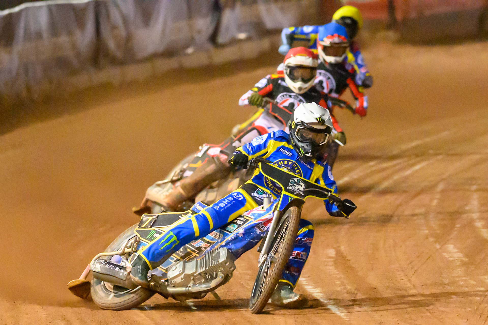 Jack Holder of Sheffield Tigers   in White leading Peter Kildemand of Belle Vue Aces   in Red, Zach Cook of Belle Vue Aces   in Blue and Anders Rowe of Sheffield Tigers    in Yellow during the Knockout Cup, Northern Section match between Belle Vue Aces and Sheffield Tigers at the National Speedway Stadium, Manchester on Monday 30th March 2026. (Photo: Ian Charles | MI News)