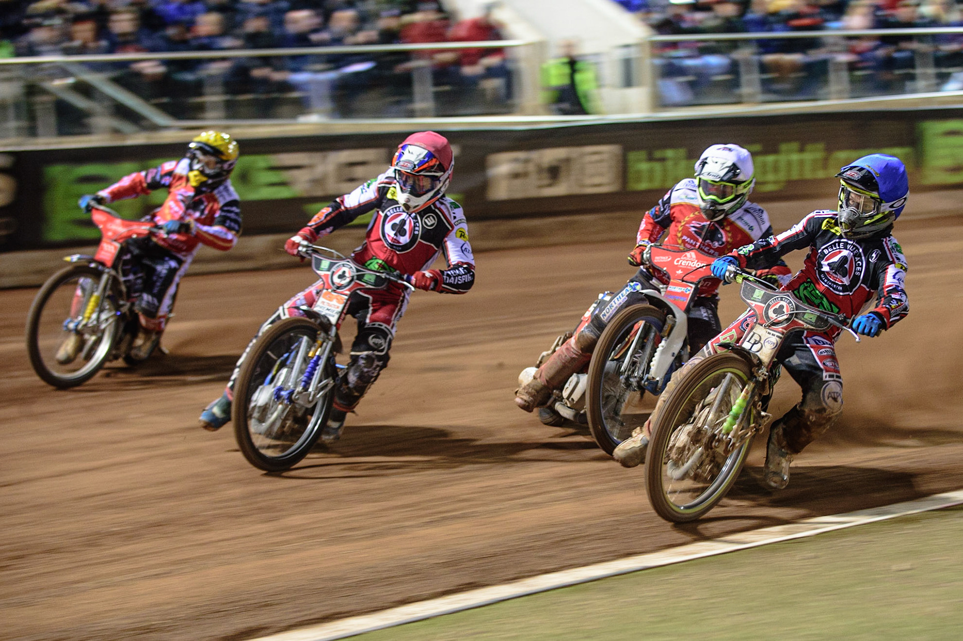MANCHESTER, UK. OCT 11TH  Charles Wright  (Blue) and Steve Worrall   (Red) lead Chris Harris  (White) and Bjarne Pedersen  (Yellow) into the first turn during the SGB Premiership Grand Final 1st Leg between Belle Vue Aces and Peterborough Panthers at the National Speedway Stadium, Manchester on Monday 11th October 2021. (Credit: Ian Charles | MI News)