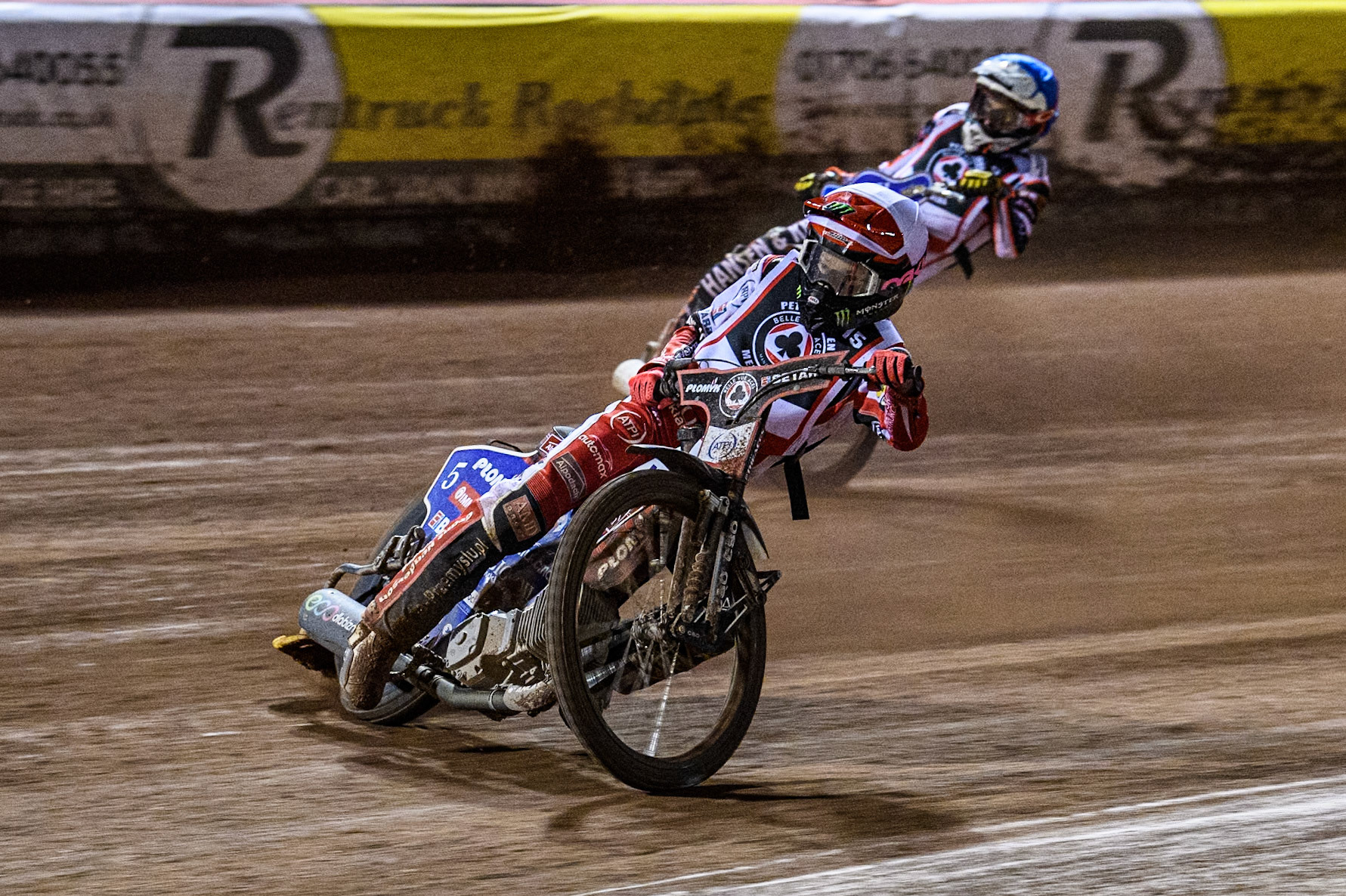 England's Dan Bewley (White) leads  Denmark's Niels-Kristian Iversen (Blue) during the Peter Craven Memorial Trophy meeting at the National Speedway Stadium, Manchester on Monday 18th March 2024. (Photo: Ian Charles | MI News)