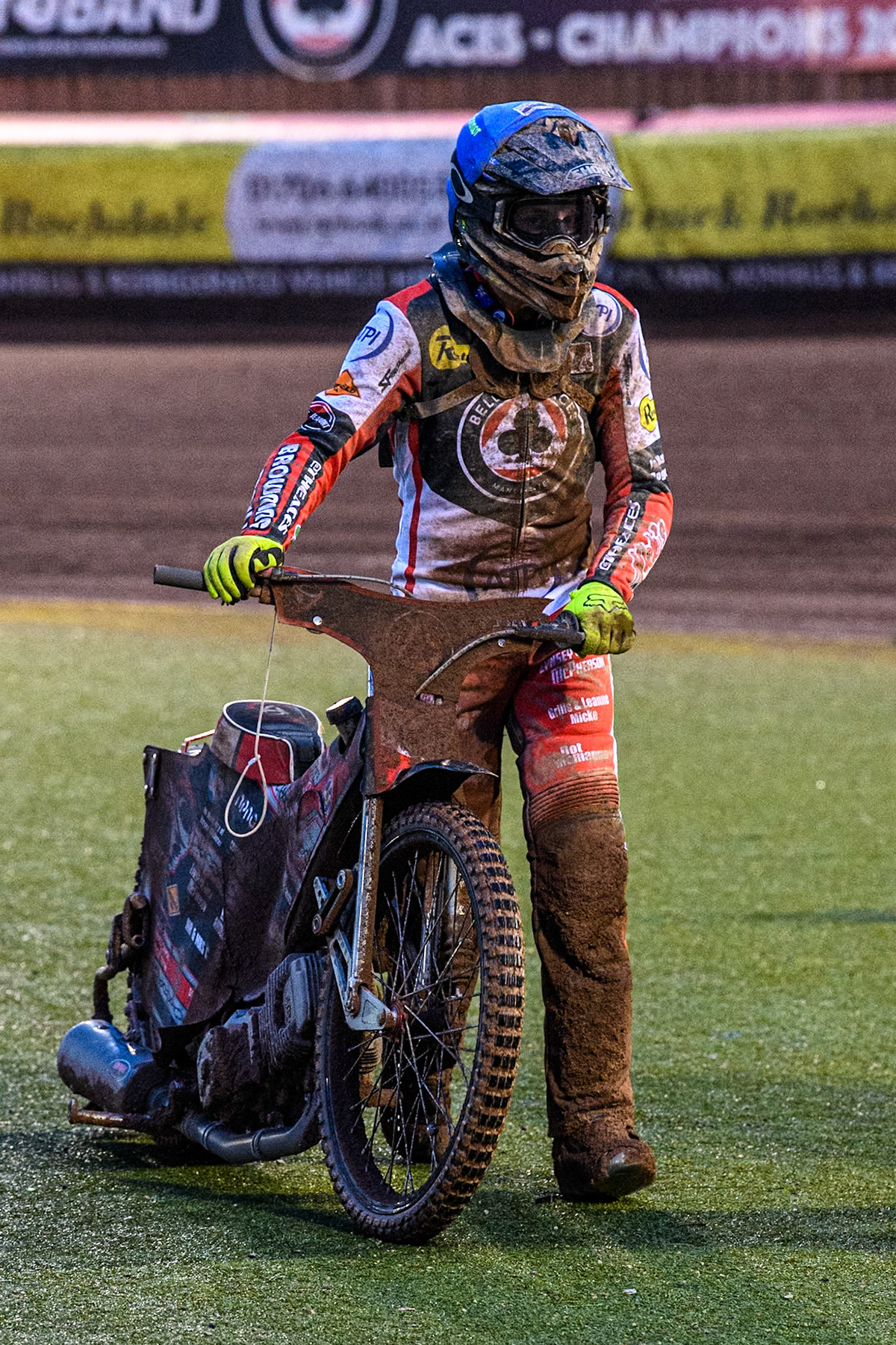 Belle Vue Aces' Connor Bailey pushes his bike back to the pits after his engine failure in Heat 8 during the Rowe Motor Oil Premiership match between Belle Vue Aces and Ipswich Witches at the National Speedway Stadium, Manchester on Monday 22nd April 2024. (Photo: Ian Charles | MI News)