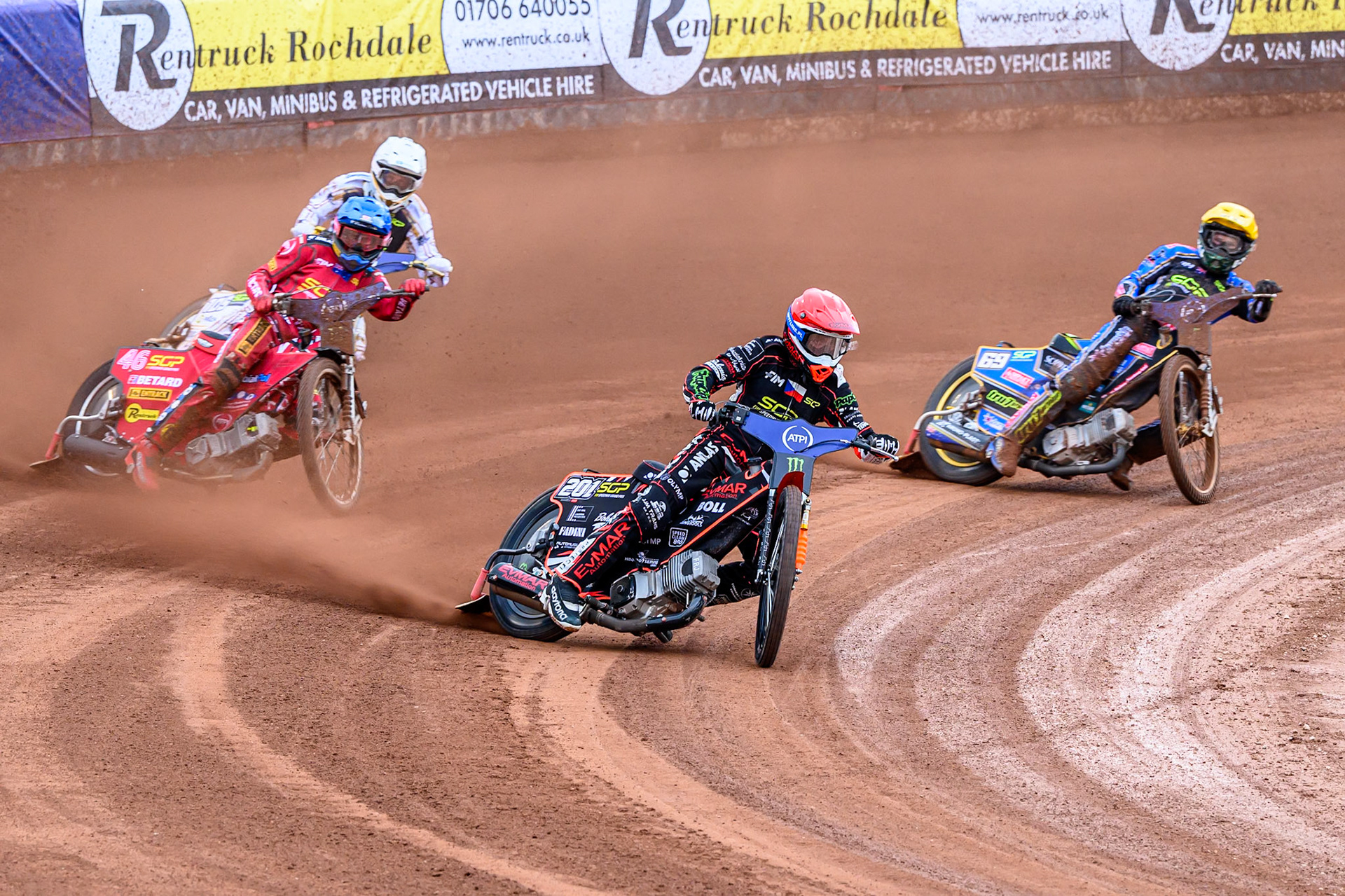 January Kvech (201) of Czech Republic in Red leading Max Fricke (46) of Australia in Blue, Jason Doyle (69) of Australia in Yellow and Anders Thomsen (105) of Denmark in White during the ATPI FIM Speedway Grand Prix Round 4 at the National Speedway Stadium, Manchester, on Friday 13th June 2025. (Photo: Ian Charles | MI News)
