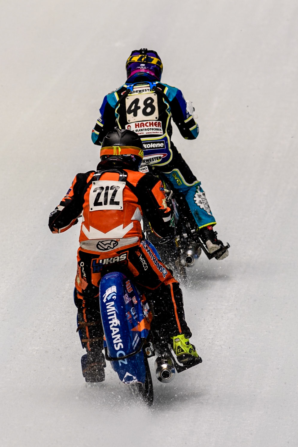 Lukas Hutla (212) of the Czech Republic chases Luca Bauer (48) of Germany during practice for  the Ice Speedway Gladiators World Championship Finals 1 &amp; 2 at Max-Aicher-Arena, Inzell on Friday 14th March 2025. (Photo: Ian Charles | MI News)