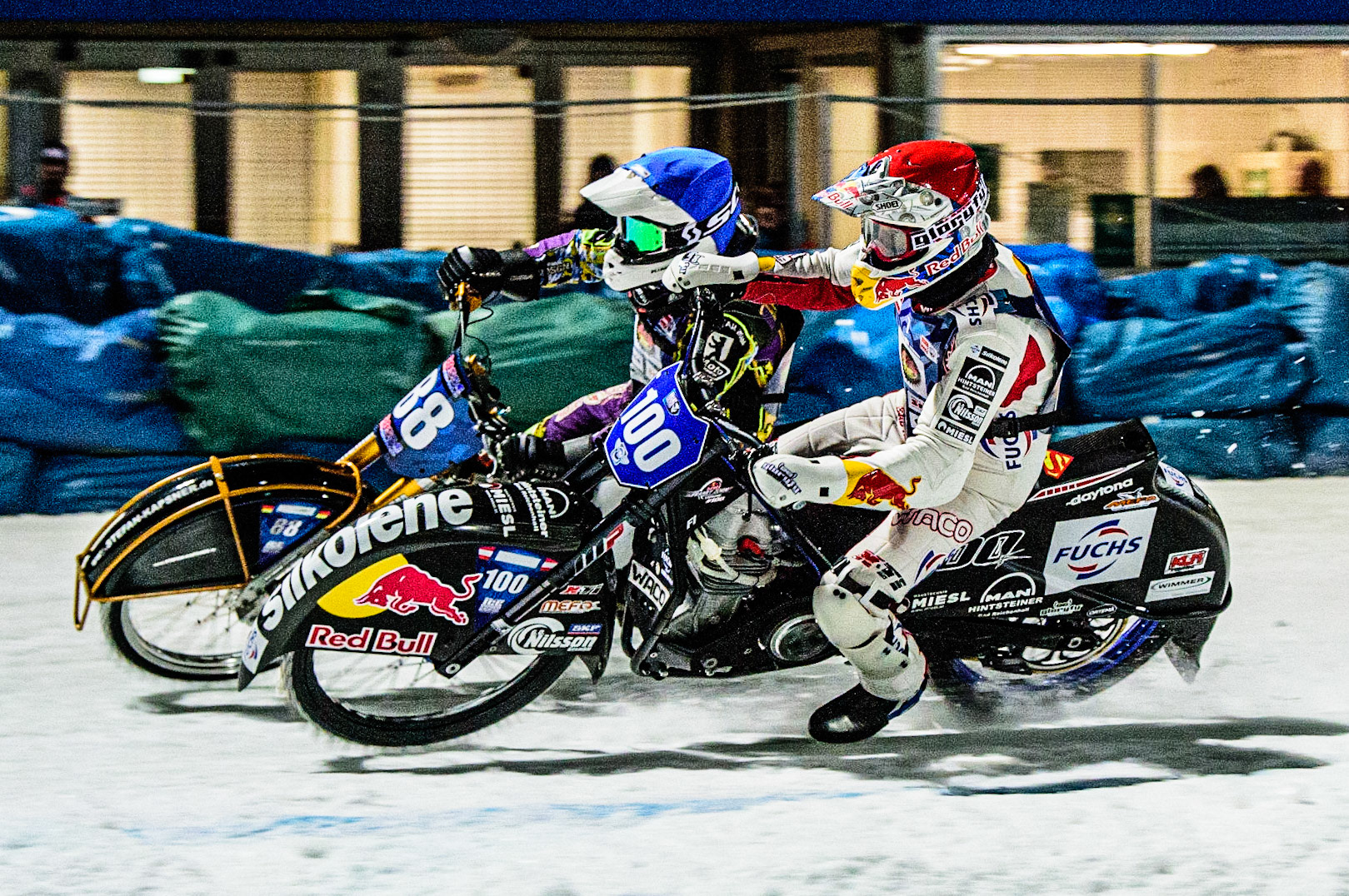 Franz Zorn (Red) inside Max Neidermaier (Blue) during the German Individual Ice Speedway Championship at Horst-Dohm-Eisstadion, Berlin on Friday 3rd March 2023. (Photo: Ian Charles | MI News)