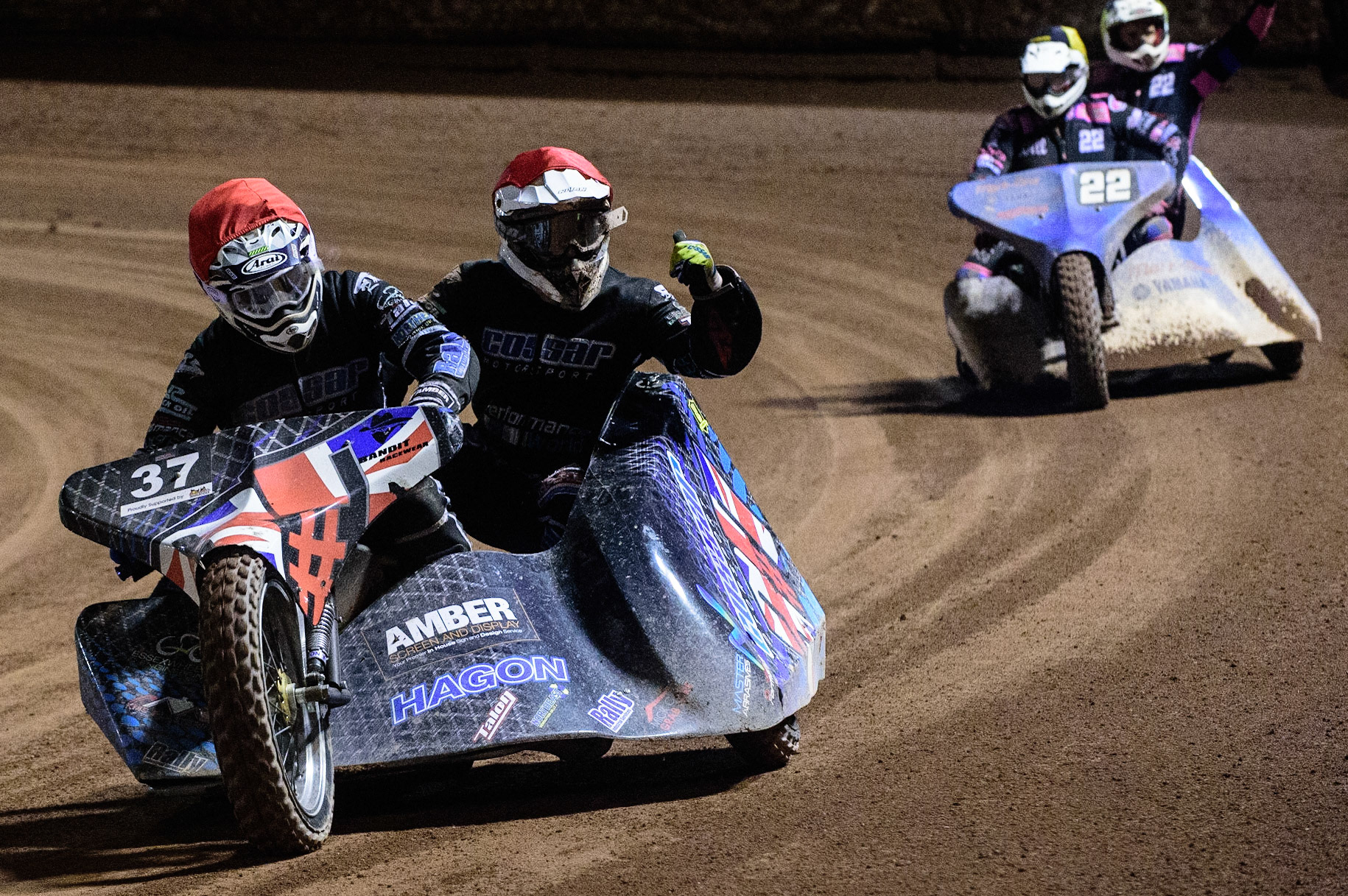 MANCHESTER, UK. OCT 30TH   Mark Cossar &amp; Gareth Williams  wave to the fans after their win during the Manchester Masters Sidecar Speedway and Flat Track Racing at the National Speedway Stadium, Manchester on Saturday 30th October 2021. (Credit: Ian Charles | MI News)