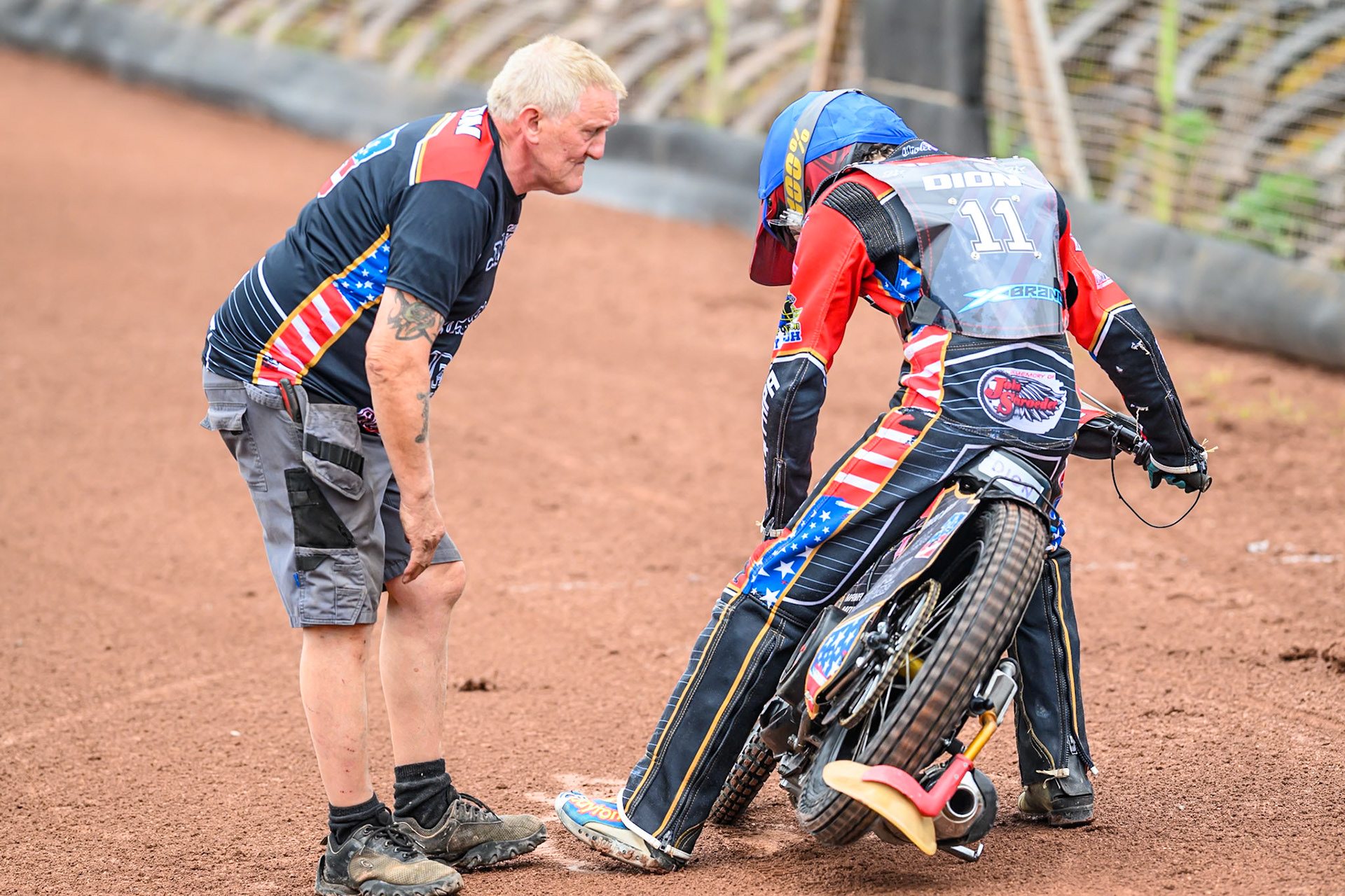 Timmy Dion of the United States gets some last minute attention from his mechanic (Left) during the FIM SGP2 Qualifying Round at the Peugeot Ashfield Stadium in Glasgow on Saturday 24th May 2025. (Photo: Ian Charles | MI News)