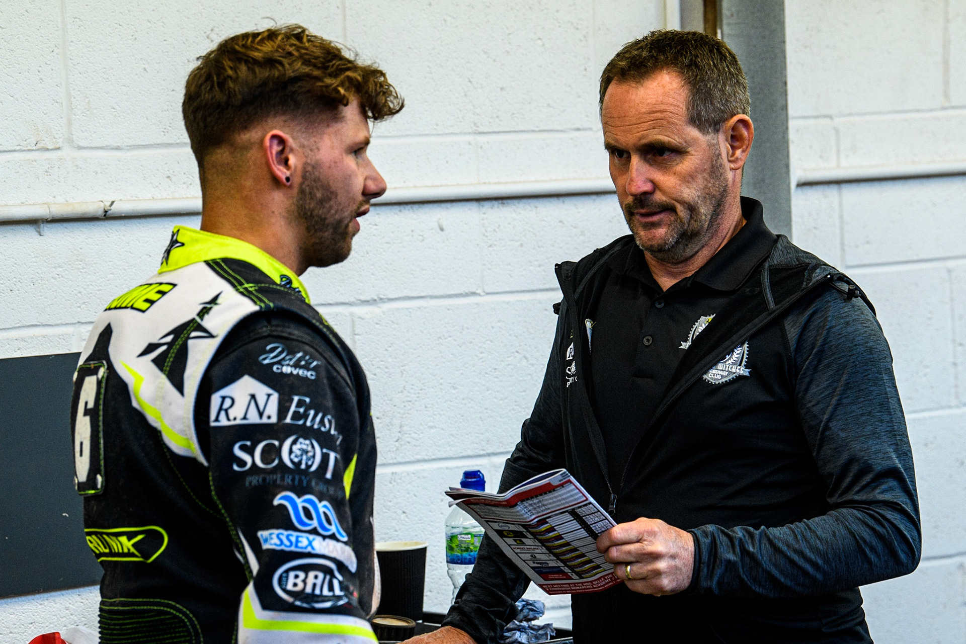 Danyon Hume (left) chats with Ipswich Team Manager Chris Louis  during the Sports Insure Premiership match between Belle Vue Aces and Ipswich Witches at the National Speedway Stadium, Manchester on Monday 17th July 2023. (Photo: Ian Charles | MI News)
