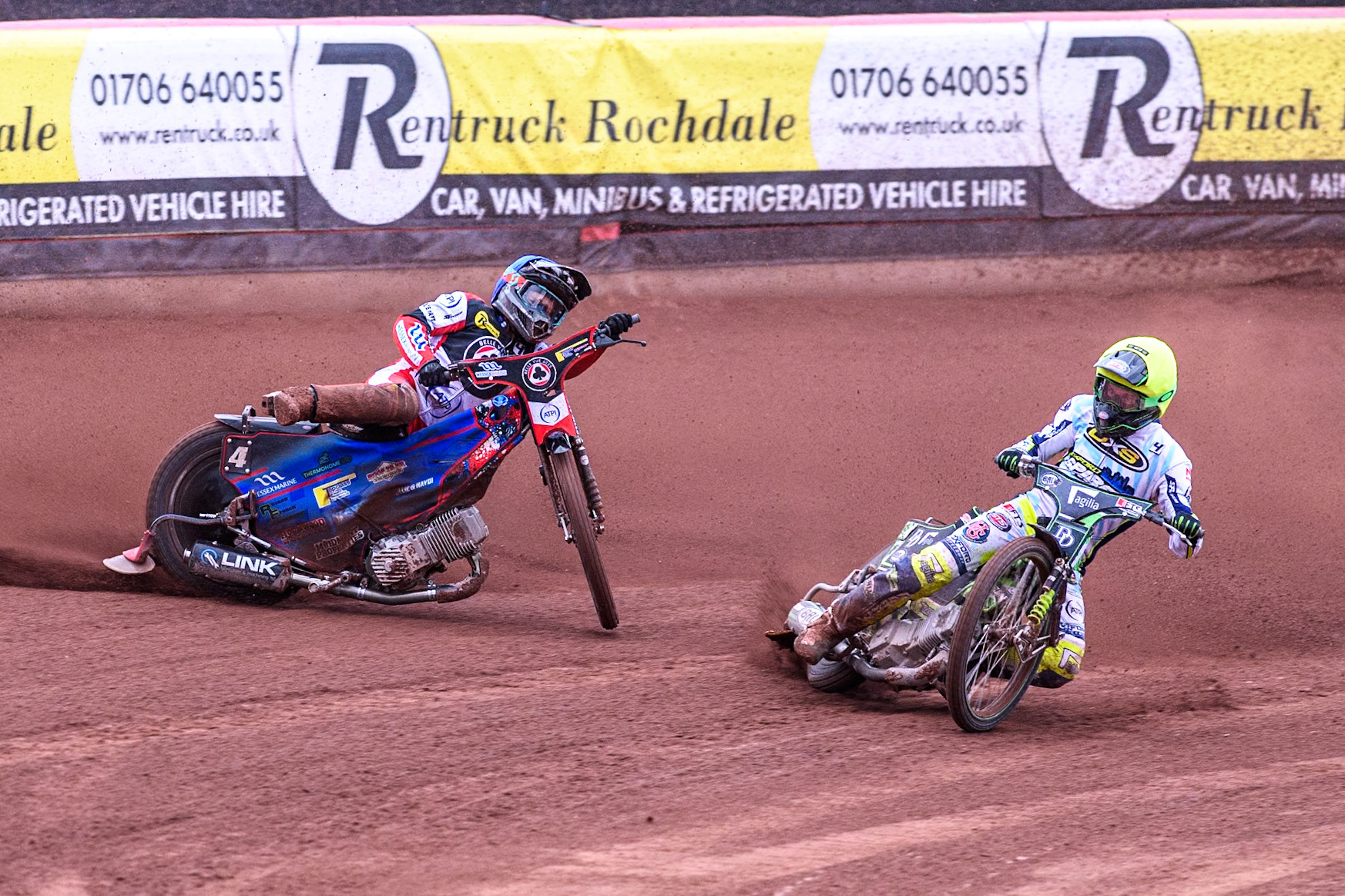 Belle Vue Aces' Ben Cook in Blue loses control after a tangle with Oxford Spires' Charles Wright in Yellow during the Rowe Motor Oil Premiership match between Belle Vue Aces and Oxford Spires at the National Speedway Stadium, Manchester on Monday 22nd July 2024. (Photo: Ian Charles | MI News)