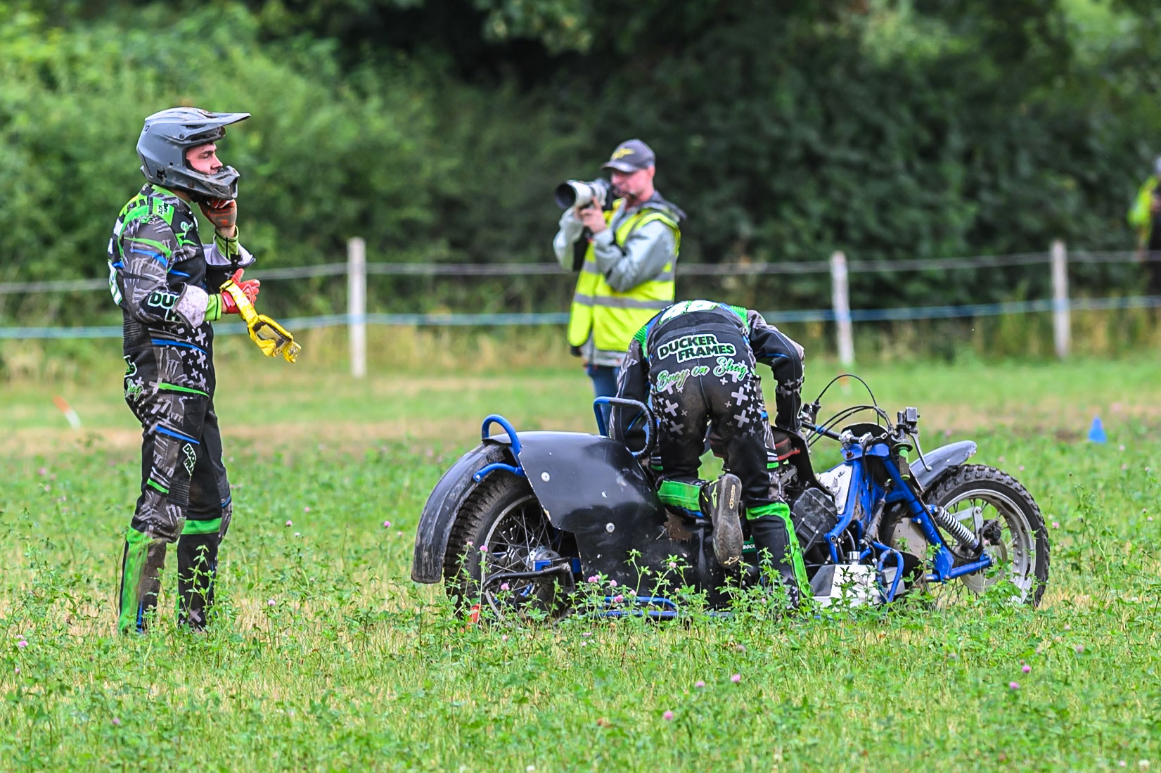 Billy Winterburn and Bradley Sheils (49) on the infield after their engine blew up in their heat in the 1000cc Sidecar class during the ACU Northern Grass Track Riders Championship at Cheshire Grass Track Club, Frog Lane, Knutsford, Cheshire on Sunday 20th July 2025. (Photo: Ian Charles | MI News)