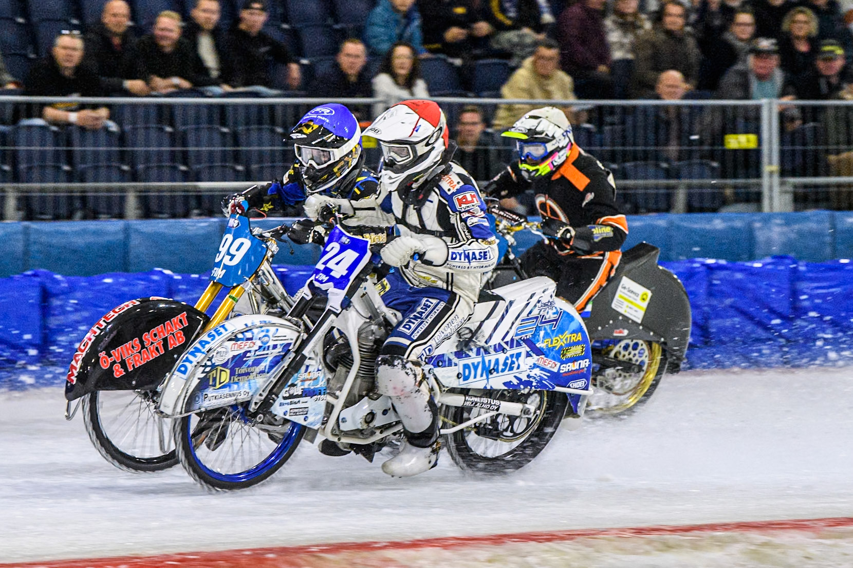 Max Koivula (24) of Finland in Red on the inside of Martin Haarahiltunen (199) of Sweden in Blue with Sebastian Reitsma (125) of The Netherlands behind during the FIM Ice Speedway Gladiators World Championship, Final 3 at the Ice Stadium, Thialf, Heerenveen on Saturday 5th April 2025. (Photo: Ian Charles | MI News)