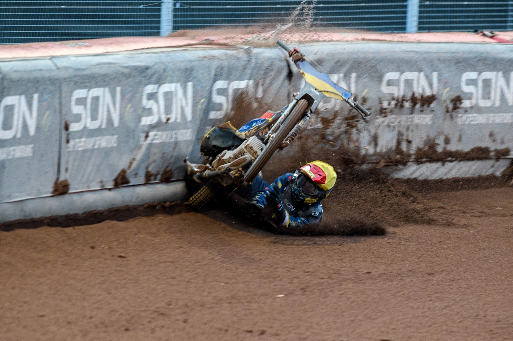 Marko Levishyn of Ukraine in Yellow crashes out of his final heat during the Monster Energy FIM Speedway of Nations Semi-Final 1 at the National Speedway Stadium, Manchester on Tuesday 9th July 2024. (Photo: Ian Charles | MI News)
