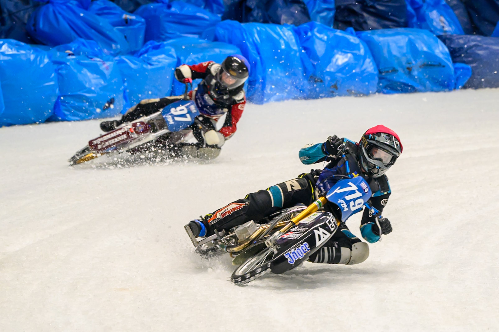 Filip Jäger (719) of Sweden in Red leading Ove Ledström (97) of Sweden in Blue during the Ice Speedway Gladiators World Championship Final 2 at Max-Aicher-Arena, Inzell on Sunday 15th March 2026. (Photo: Ian Charles | MI News)