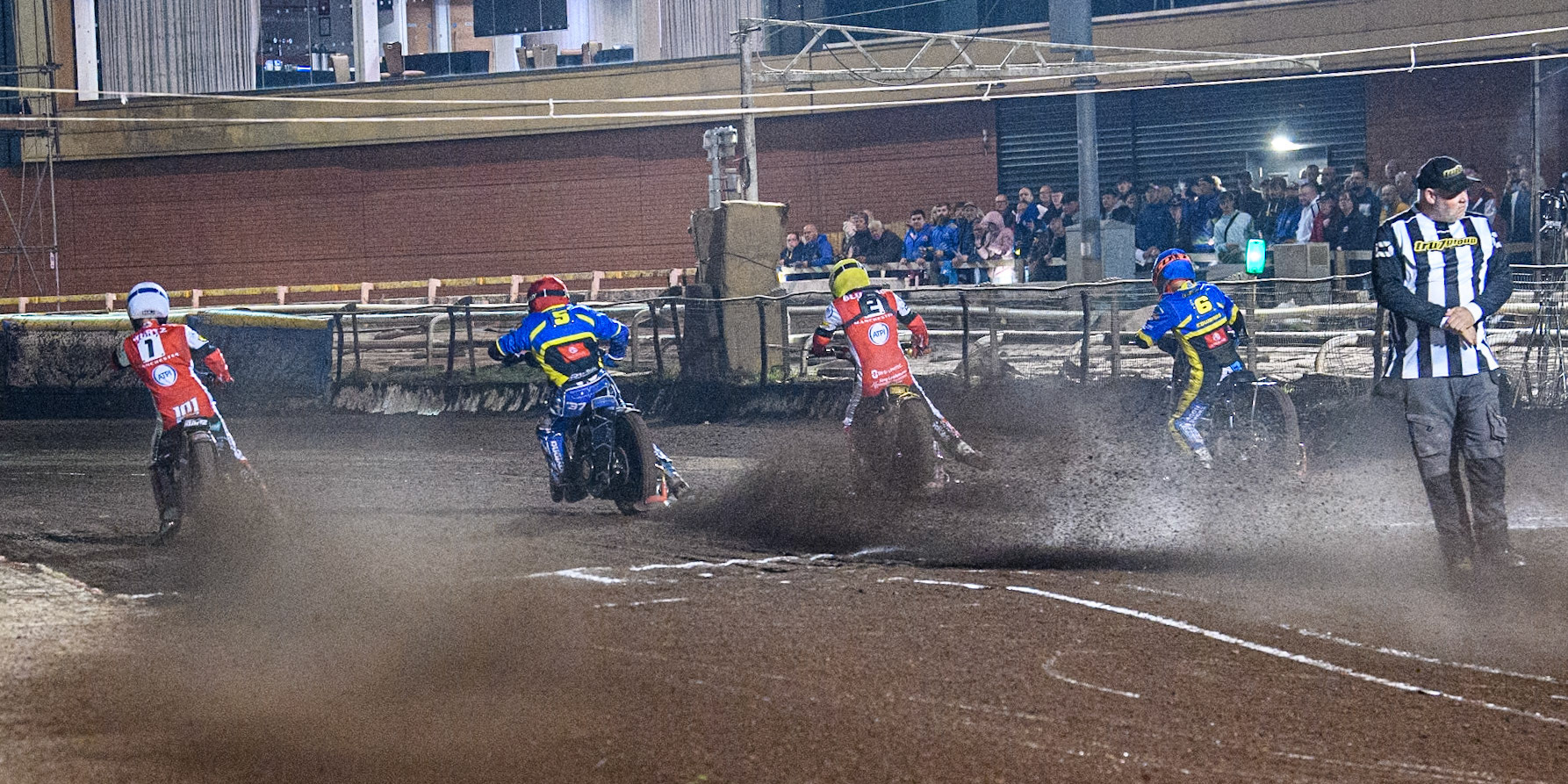 The start of heat 11 and the riders roar away from the tapes: (L to R) Belle Vue Aces' Brady Kurtz  in White, Sheffield Tigers' Guest Rider Chris Harris  in Red, Belle Vue Aces' Norick Blodorn  in Yellow and Sheffield Tigers' Jason Edwards  in Blue during the Rowe Motor Oil Premiership Play Off Semi Final 2nd leg between Sheffield Tigers and Belle Vue Aces at Owlerton Stadium, Sheffield on Thursday 19th September 2024. (Photo: Ian Charles | MI News)