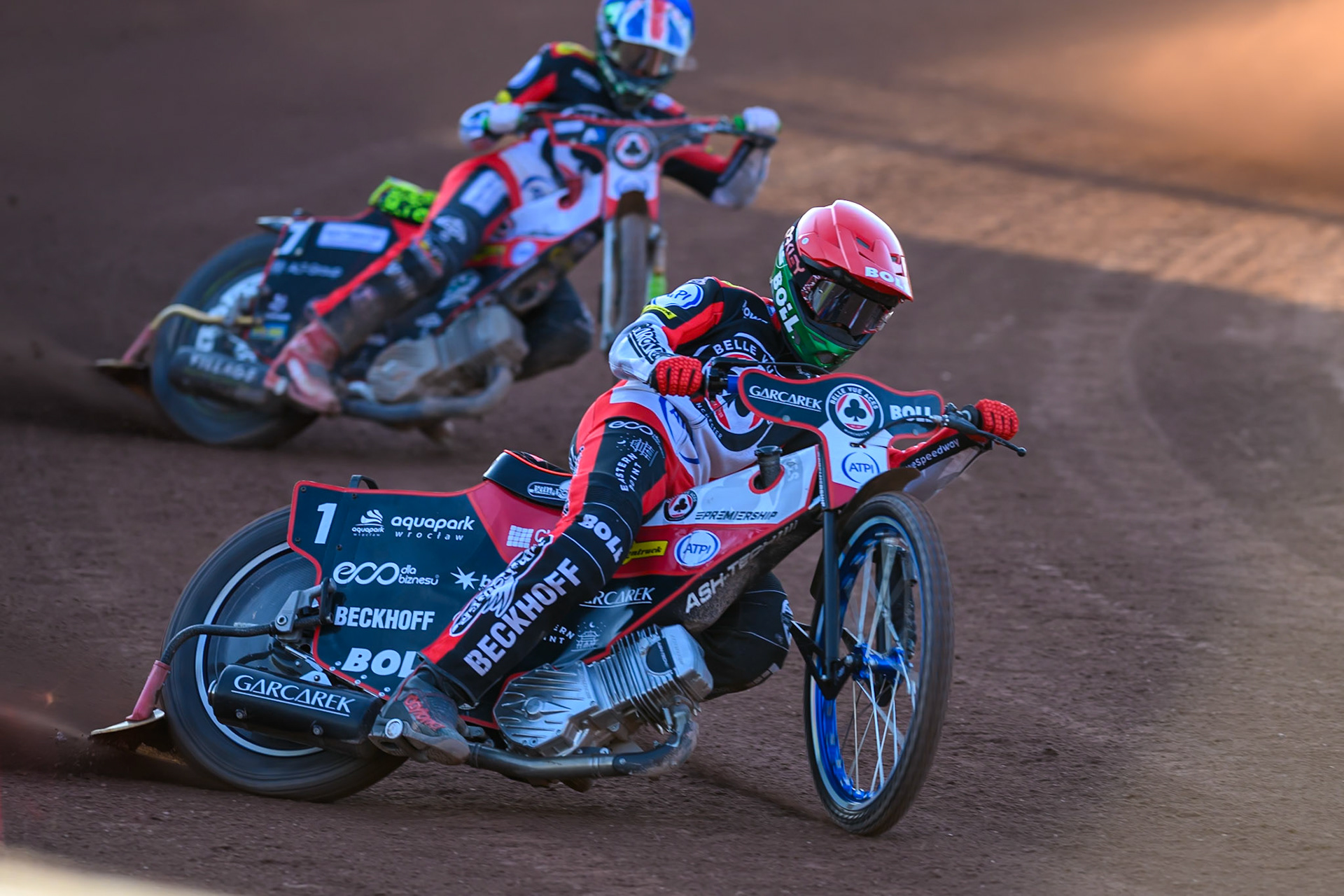 Brady Kurtz of Belle Vue Aces in Red leading William Cairns of Belle Vue Aces in Blue during the Rowe Motor Oil Premiership match between Belle Vue Aces and Northampton Foxes at the National Speedway Stadium, Manchester on Monday 13th July 2026. (Photo: Ian Charles | MI News)