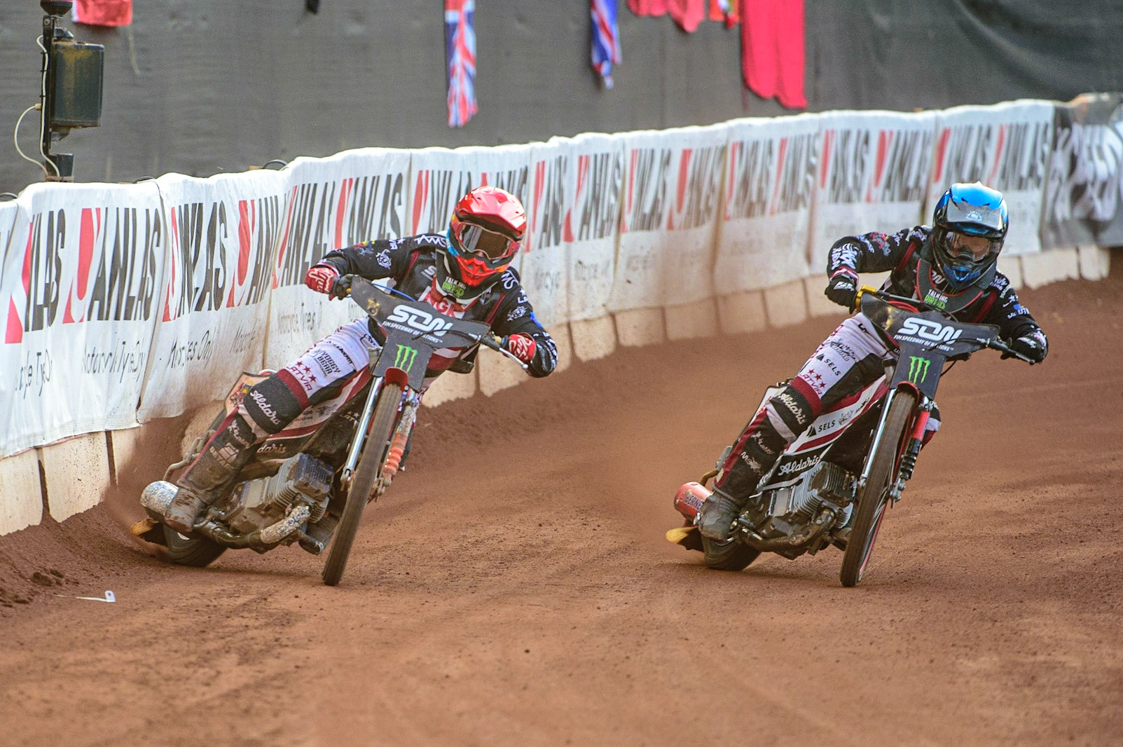 MANCHESTER, UK. OCT 16TH Andzejs Lebedevs of Latvia (Red) and Olegs Mijailovs of Latvia (Blue) in action  during the Monster Energy FIM Speedway of Nations at the National Speedway Stadium, Manchester on Saturday  16th October 2021. (Credit: Ian Charles | MI News)