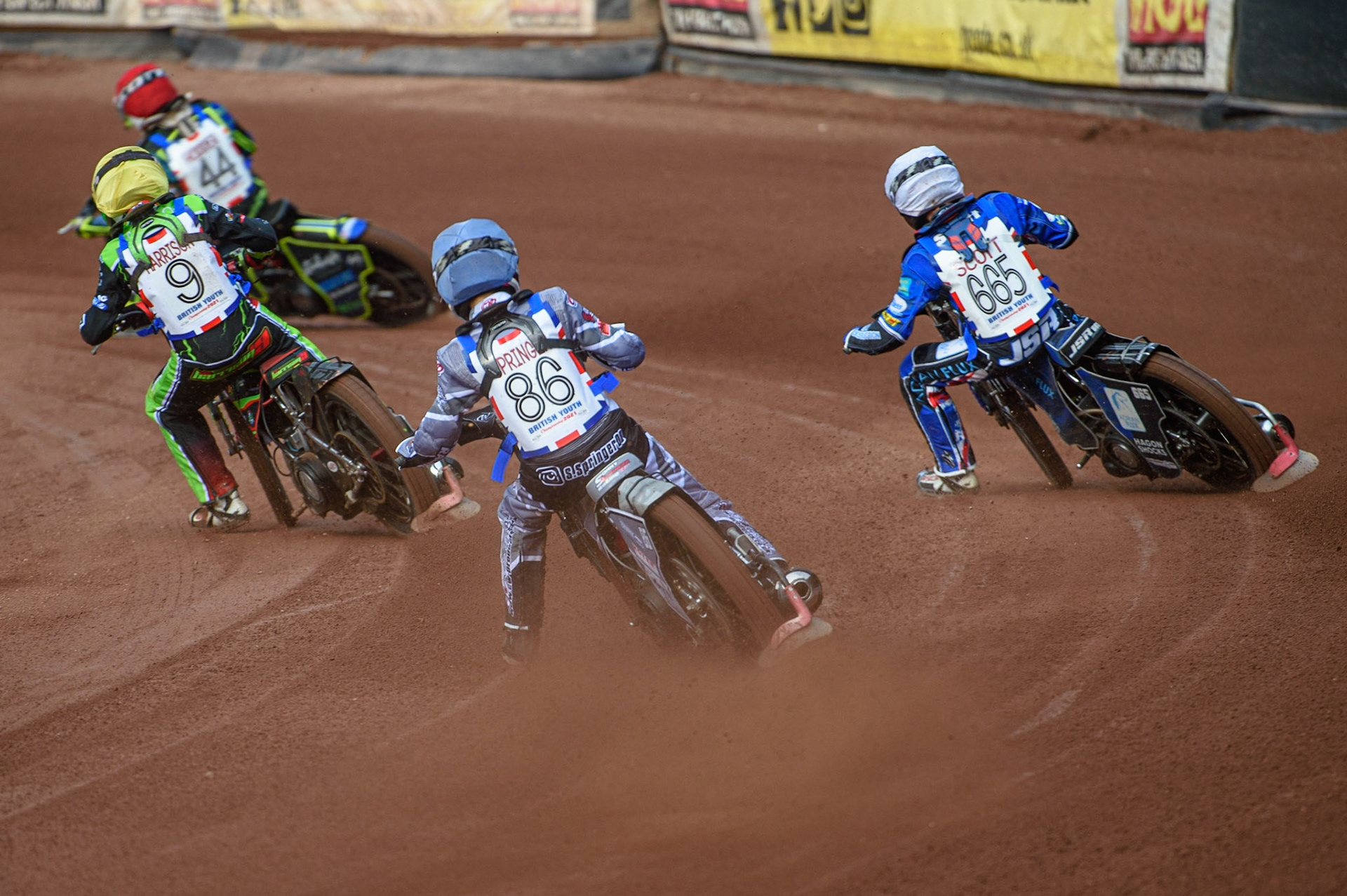 MANCHESTER, UK. MAY 28TH   Sonny Springer  (Blue) chases Jody Scott (White), Luke Harrison  (Yellow) and Freddy Hodder  (Red) during the British Junior Championship at the National Speedway Stadium, Manchester on Friday 28th May 2021. (Credit: Ian Charles | MI News)