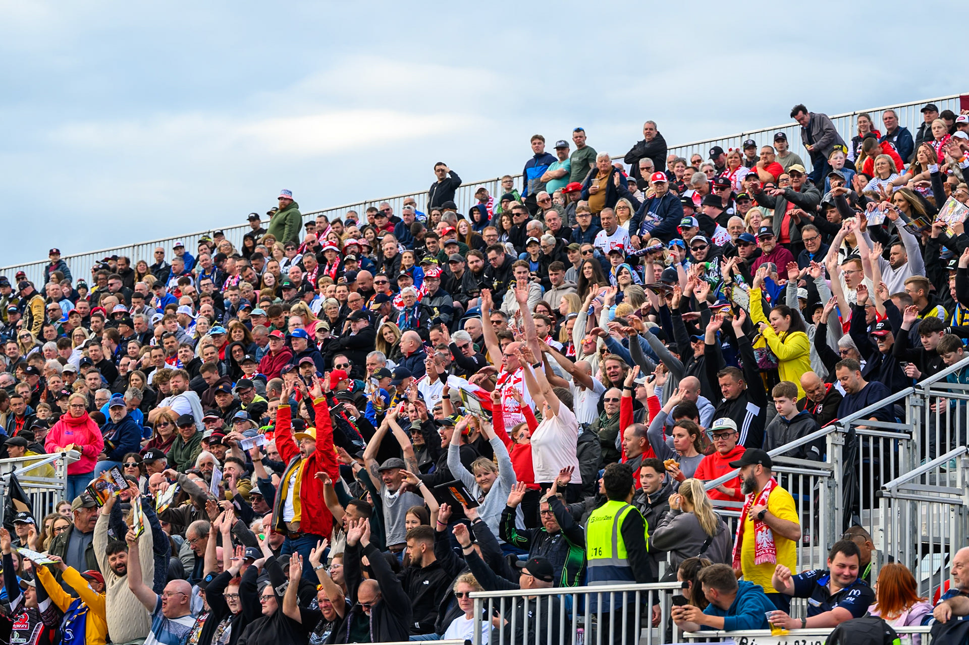 Fans in the East stand doing the Mexican wave during the ATPI  FIM Speedway GP of Manchester at the National Speedway Stadium, Manchester on Saturday 6th June 2026. (Photo: Ian Charles | MI News)