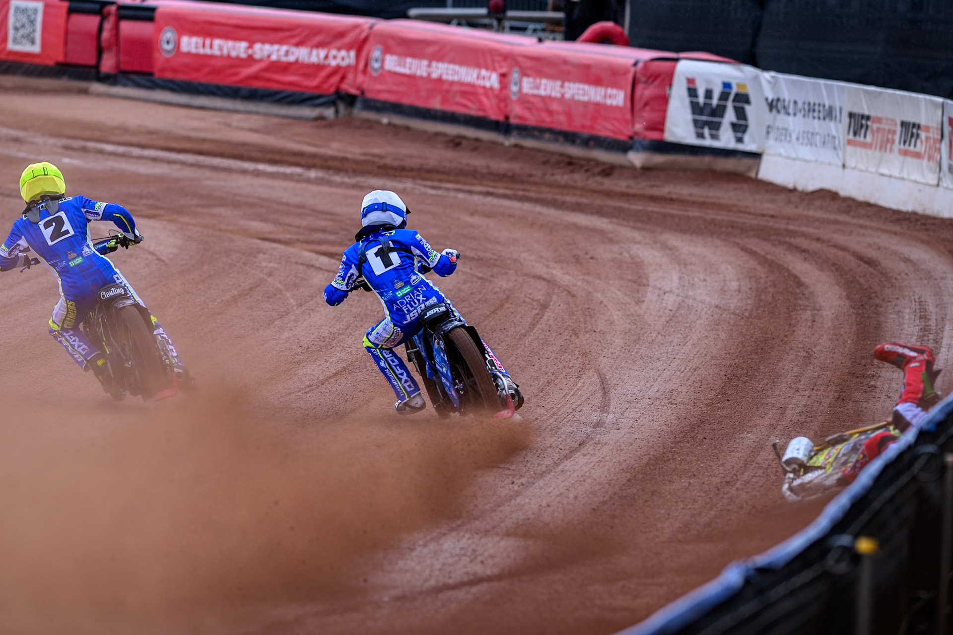 Belle Vue Colts' William Cairns falls whilst trying to pass Oxford Chargers' Jody Scott  in White and Oxford Chargers' Jacob Clouting  in Yellow during the WSRA National Development League match between Belle Vue Colts and Oxford Chargers at the National Speedway Stadium, Manchester on Sunday 1st June 2025. (Photo: Ian Charles | MI News)