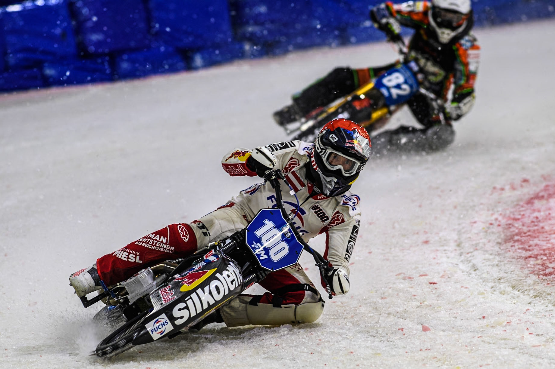 Austria's Franz Zorn (100) in Red leading Germany's Markus Jell (82) in White during the FIM Ice Speedway Gladiators World Championship Final 3 at Ice Rink Thialf, Heerenveen on Saturday 6th April 2024. (Photo: Ian Charles | MI News)