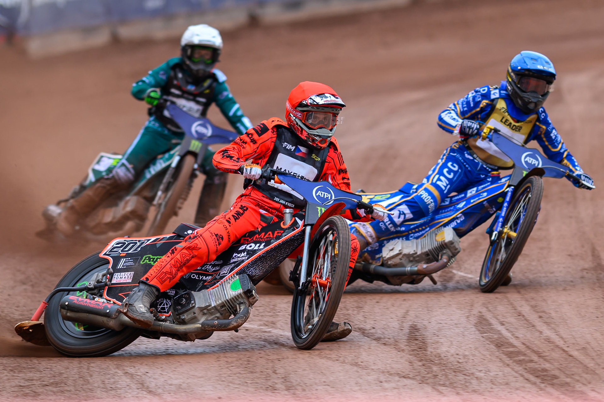 Jan Kvech (201) of Czech Republic in Red leading Bartosz Zmarzlik (95) of Poland in Blue and Leon Madsen (30) of Denmark in White during the ATPI  FIM Speedway GP of Manchester at the National Speedway Stadium, Manchester on Saturday 6th June 2026. (Photo: Ian Charles | MI News)