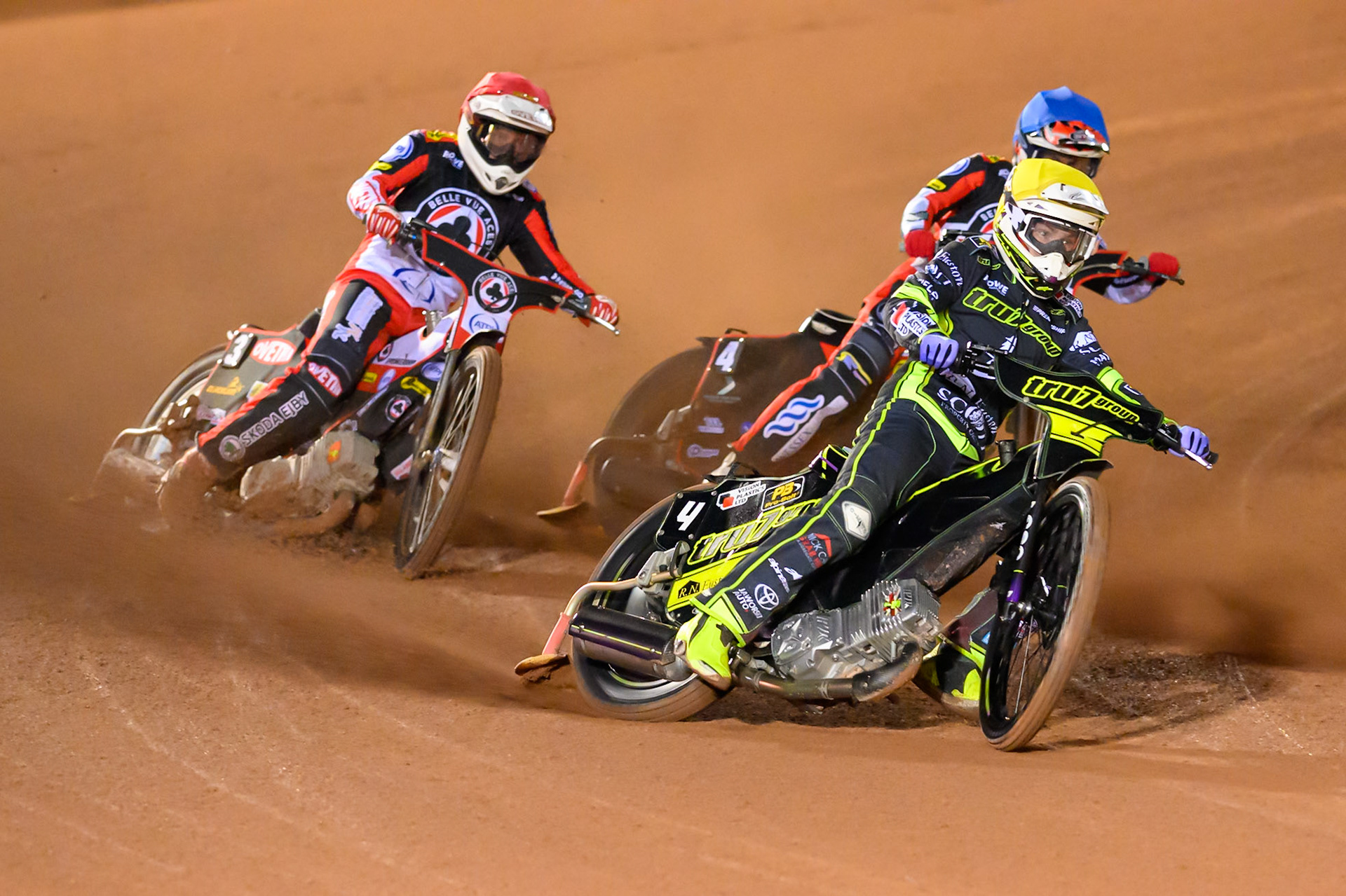 Tom Brennan of Ipswich Witches in Yellow leading Peter Kildemand of Belle Vue Aces in Red  and Zach Cook of Belle Vue Aces in Blue  during the Rowe Motor Oil Premiership Play Off Semi Final 2nd leg match between Belle Vue Aces and Ipswich Witches at the National Speedway Stadium, Manchester on Monday 28th September 2026. (Photo: Ian Charles | MI News)