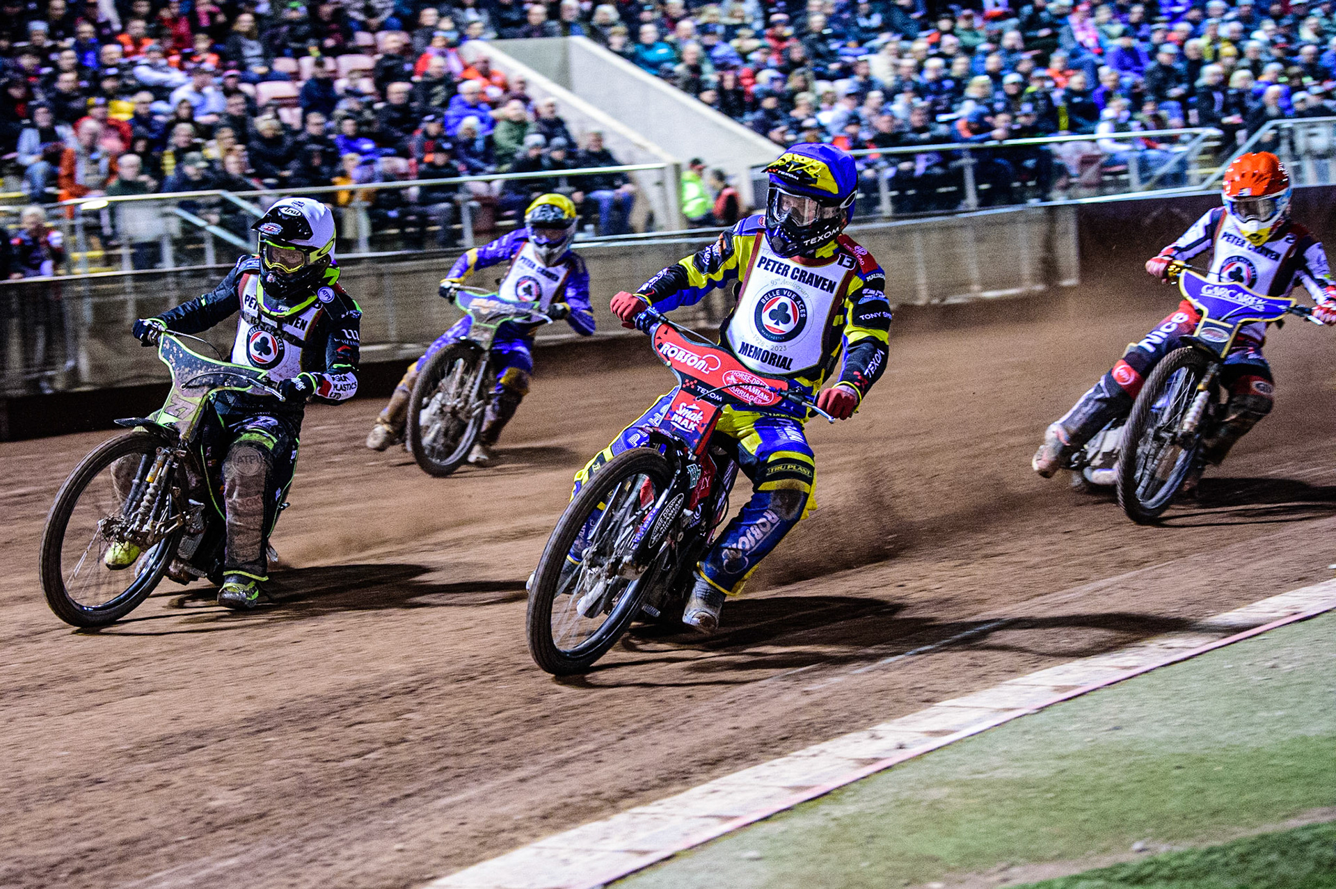 Tobiasz Musielak  (Blue) leads Tom Brennan  (White) Robert Lambert  (Red) and Kye Thompson  (Yellow) during the Peter Craven Memorial Trophy  at the National Speedway Stadium, Manchester on Monday 3rd April 2023. (Photo: Ian Charles | MI News)