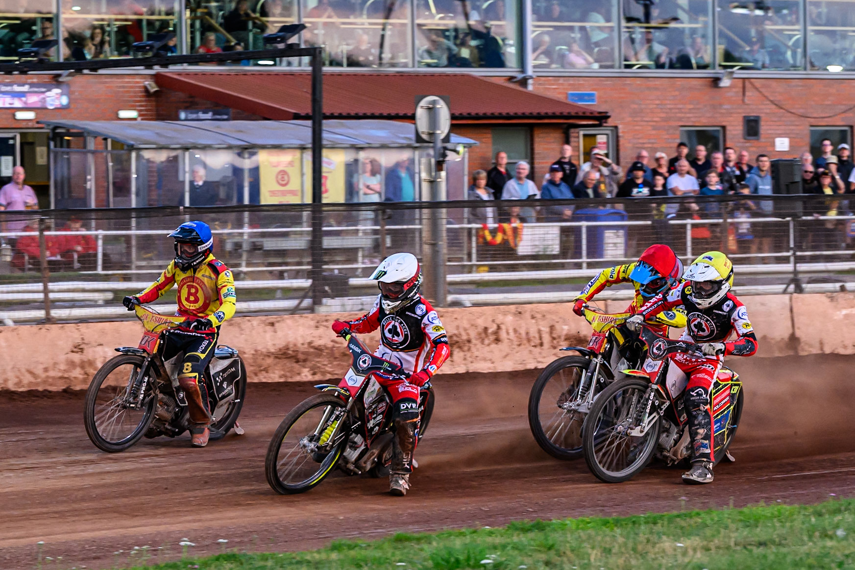Belle Vue Aces' Jaimon Lidsey  in White leading Birmingham Brummies' Tobias Musielak  in Blue Belle Vue Aces' Tate Zischke  in Yellow and Birmingham Brummies' Jonas Jeppesen  in Red away from the start during the Rowe Motor Oil Premiership match between Birmingham Brummies and Belle Vue Aces at Perry Barr Stadium, Birmingham on Monday 28th July 2025. (Photo: Ian Charles | MI News)