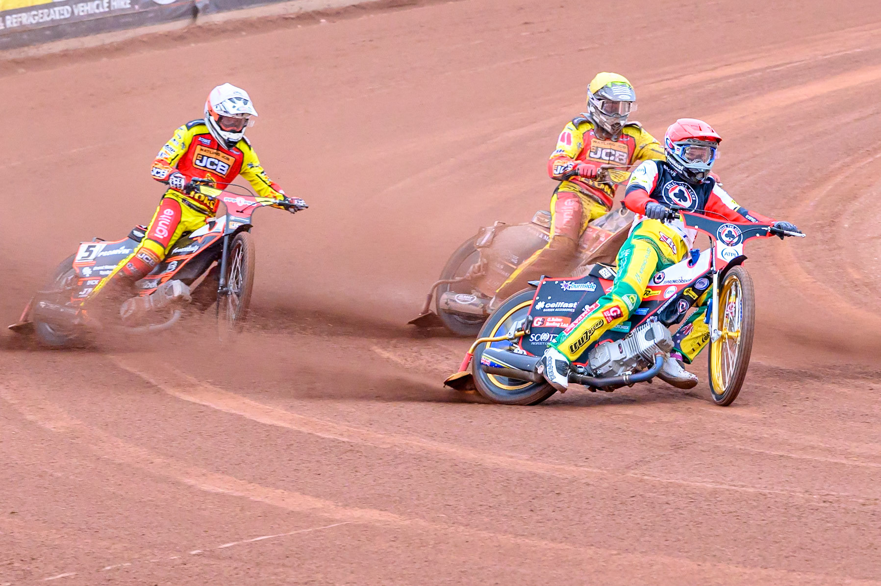 Jason Doyle of Belle Vue Aces in Red leading Sam Masters of Leicester Lions in White and Joe Thompson of Leicester Lions in Yellow during the Rowe Motor Oil Premiership match between Belle Vue Aces and Leicester Lions at the National Speedway Stadium, Manchester on Monday 15th June 2026. (Photo: Ian Charles | MI News)