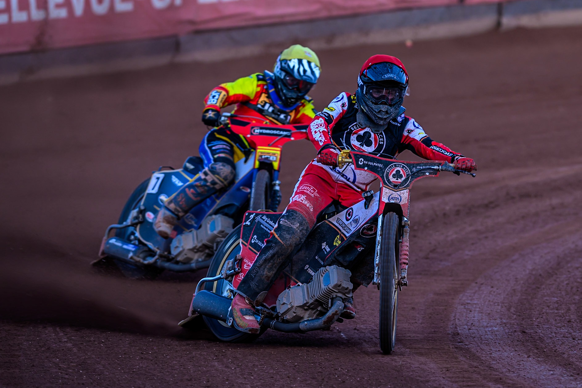 Belle Vue Aces' Norick Blödorn in Red leading Leicester Lions' Joe Thompson  in Yellow during the Rowe Motor Oil Premiership match between Belle Vue Aces and Leicester Lions at the National Speedway Stadium, Manchester on Monday 14th July 2025. (Photo: Ian Charles | MI News)